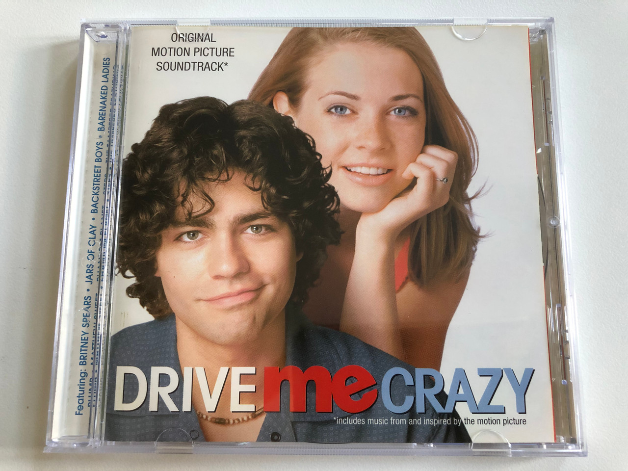 https://cdn10.bigcommerce.com/s-62bdpkt7pb/products/0/images/196611/Drive_Me_Crazy_Original_Motion_Picture_Soundtrack_Jive_Audio_CD_1999_724384869427_1__27878.1634839213.1280.1280.JPG?c=2&_gl=1*v87rp9*_ga*MjA2NTIxMjE2MC4xNTkwNTEyNTMy*_ga_WS2VZYPC6G*MTYzNDgzNTM5OC4xMzUuMS4xNjM0ODM5MDc0LjM5