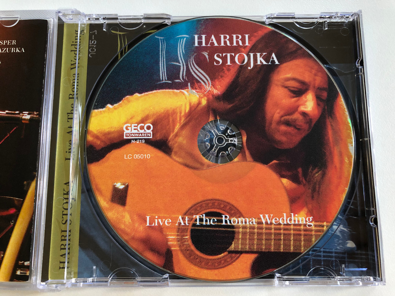 https://cdn10.bigcommerce.com/s-62bdpkt7pb/products/0/images/196707/Harri_Stojka_Live_At_The_Roma_Wedding_Geco_Tonwaren_Audio_CD_2004_H-219_3__64755.1634913759.1280.1280.JPG?c=2&_gl=1*100ll6r*_ga*MjA2NTIxMjE2MC4xNTkwNTEyNTMy*_ga_WS2VZYPC6G*MTYzNDkwOTU4OC4xMzcuMS4xNjM0OTEzNTAxLjY.