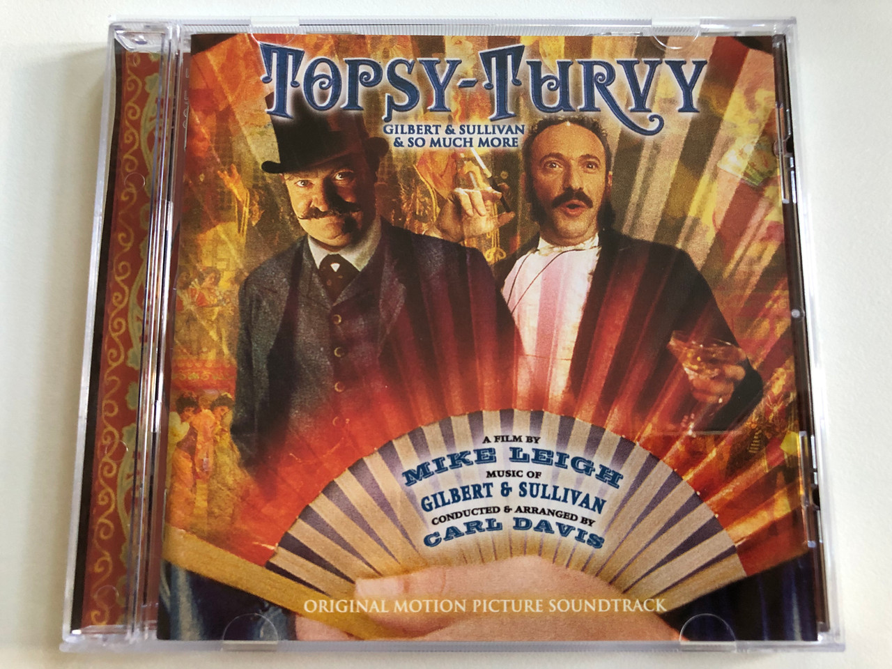 https://cdn10.bigcommerce.com/s-62bdpkt7pb/products/0/images/196822/Topsy-Turvy_Original_Motion_Picture_Soundtrack_-_Gilbert_Sullivan_So_Much_More_A_Film_By_Mike_Leigh_Music_Of_Gilbert_Sullivan_Conducted_Arranged_by_Carl_Davis_Sony_Classical_Aud_1__43207.1635143306.1280.1280.JPG?c=2&_gl=1*17y7rys*_ga*MjA2NTIxMjE2MC4xNTkwNTEyNTMy*_ga_WS2VZYPC6G*MTYzNTE0MTM4MC4xMzguMS4xNjM1MTQzMDg1LjQz