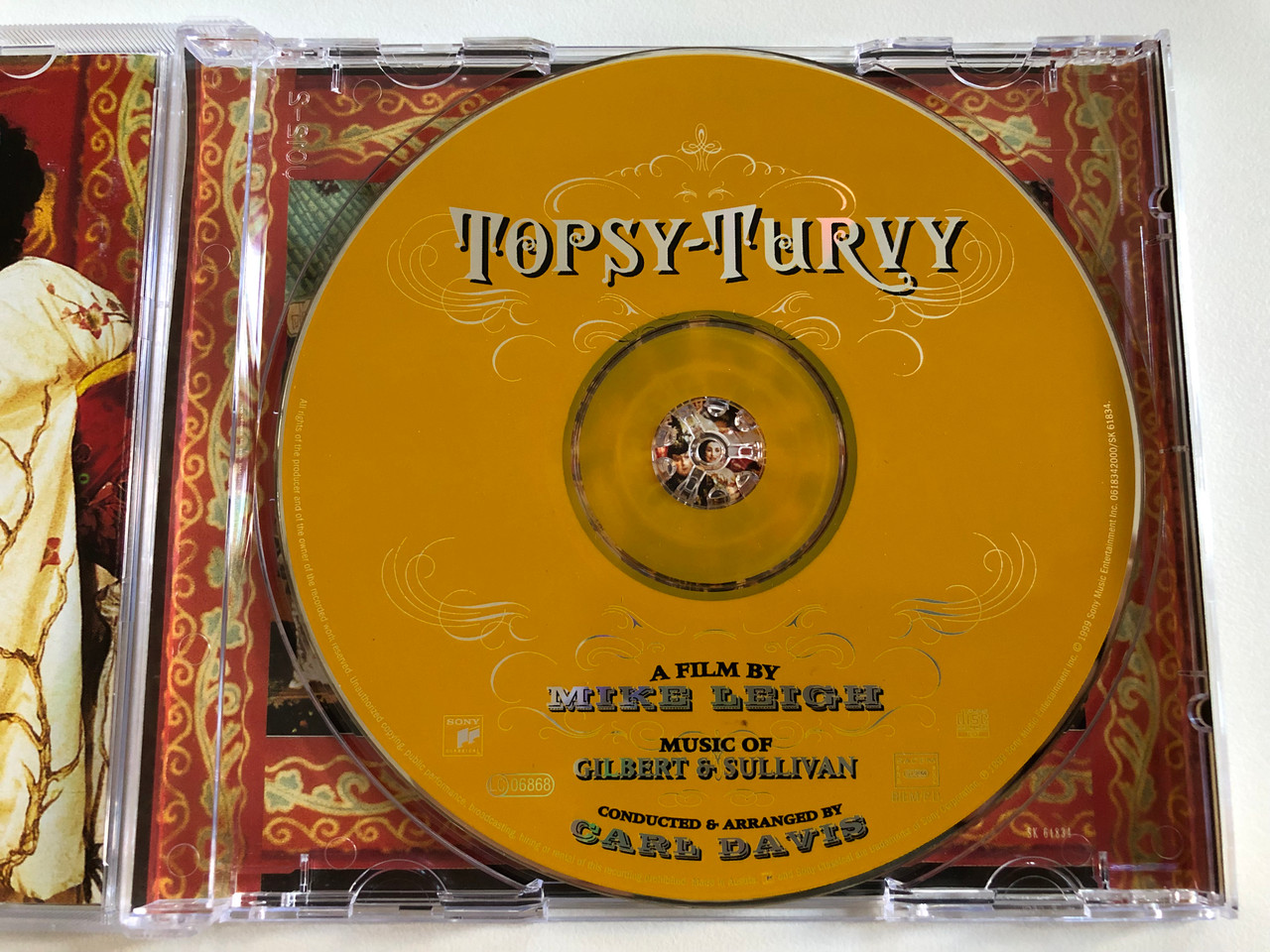https://cdn10.bigcommerce.com/s-62bdpkt7pb/products/0/images/196823/Topsy-Turvy_Original_Motion_Picture_Soundtrack_-_Gilbert_Sullivan_So_Much_More_A_Film_By_Mike_Leigh_Music_Of_Gilbert_Sullivan_Conducted_Arranged_by_Carl_Davis_Sony_Classical_A_3__28260.1635143306.1280.1280.JPG?c=2&_gl=1*17y7rys*_ga*MjA2NTIxMjE2MC4xNTkwNTEyNTMy*_ga_WS2VZYPC6G*MTYzNTE0MTM4MC4xMzguMS4xNjM1MTQzMDg1LjQz