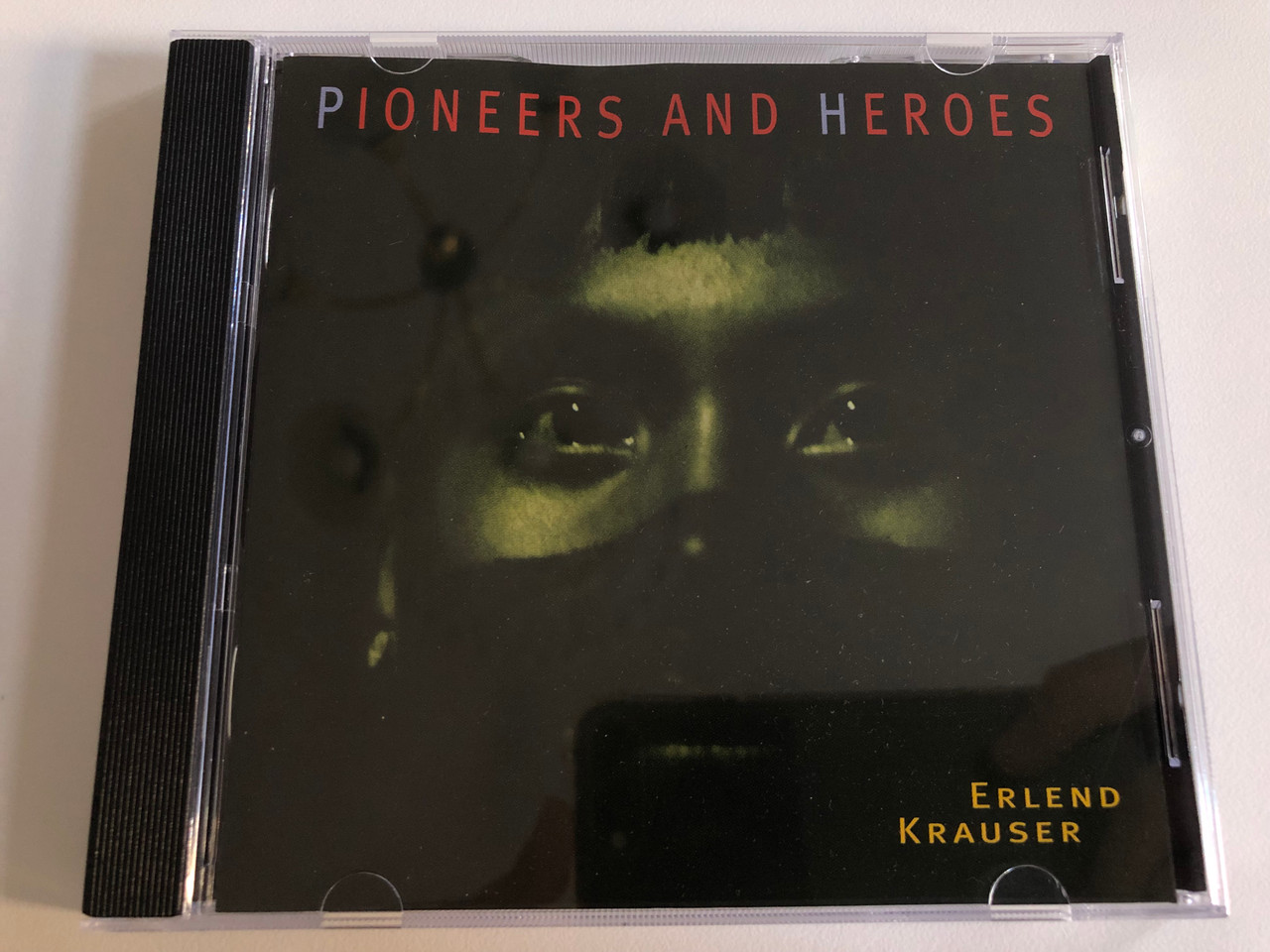 https://cdn10.bigcommerce.com/s-62bdpkt7pb/products/0/images/196990/Pioneers_And_Heroes_-_Erlend_Krauser_Erdenklang_Audio_CD_1996_60902_1__92630.1635232209.1280.1280.JPG?c=2&_gl=1*1ncfeqk*_ga*MjA2NTIxMjE2MC4xNTkwNTEyNTMy*_ga_WS2VZYPC6G*MTYzNTIyNDk1Ni4xNDEuMS4xNjM1MjMyMDQ2LjI1