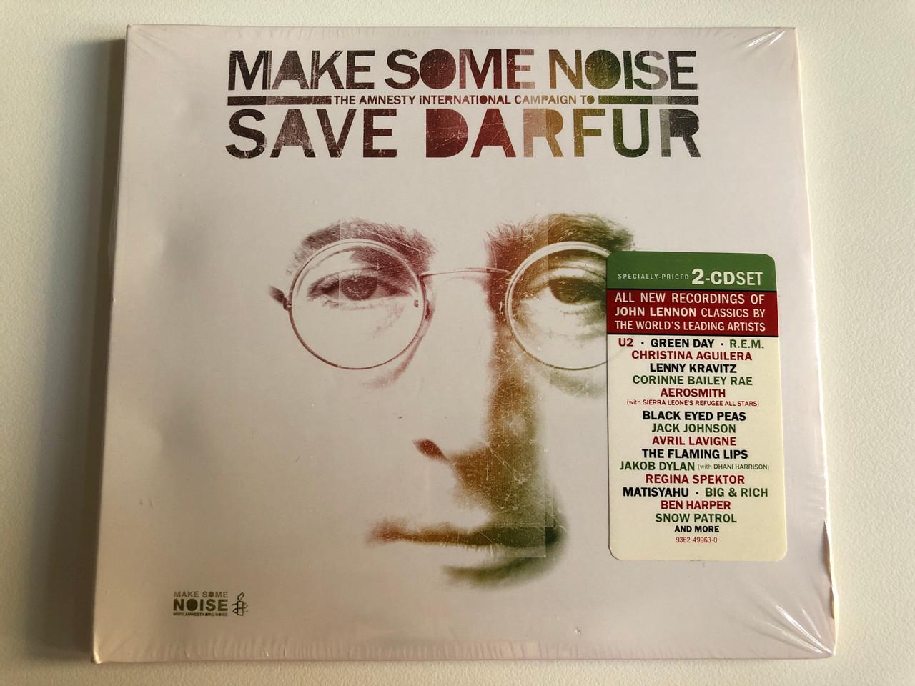 https://cdn10.bigcommerce.com/s-62bdpkt7pb/products/0/images/197817/Make_Some_Noise_The_Amnesty_International_Campaign_To_Save_Darfur_All_New_Recordings_Of_John_Lennon_Classics_By_The_Worlds_Leading_Artists_U2_Green_Day_R.E.M._Christina_Aguilera_Warner_1__82515.1635792468.1280.1280.JPG?c=2&_gl=1*caf6w5*_ga*MjA2NTIxMjE2MC4xNTkwNTEyNTMy*_ga_WS2VZYPC6G*MTYzNTc4NDc2OC4xNTAuMS4xNjM1NzkyMTY2LjYw