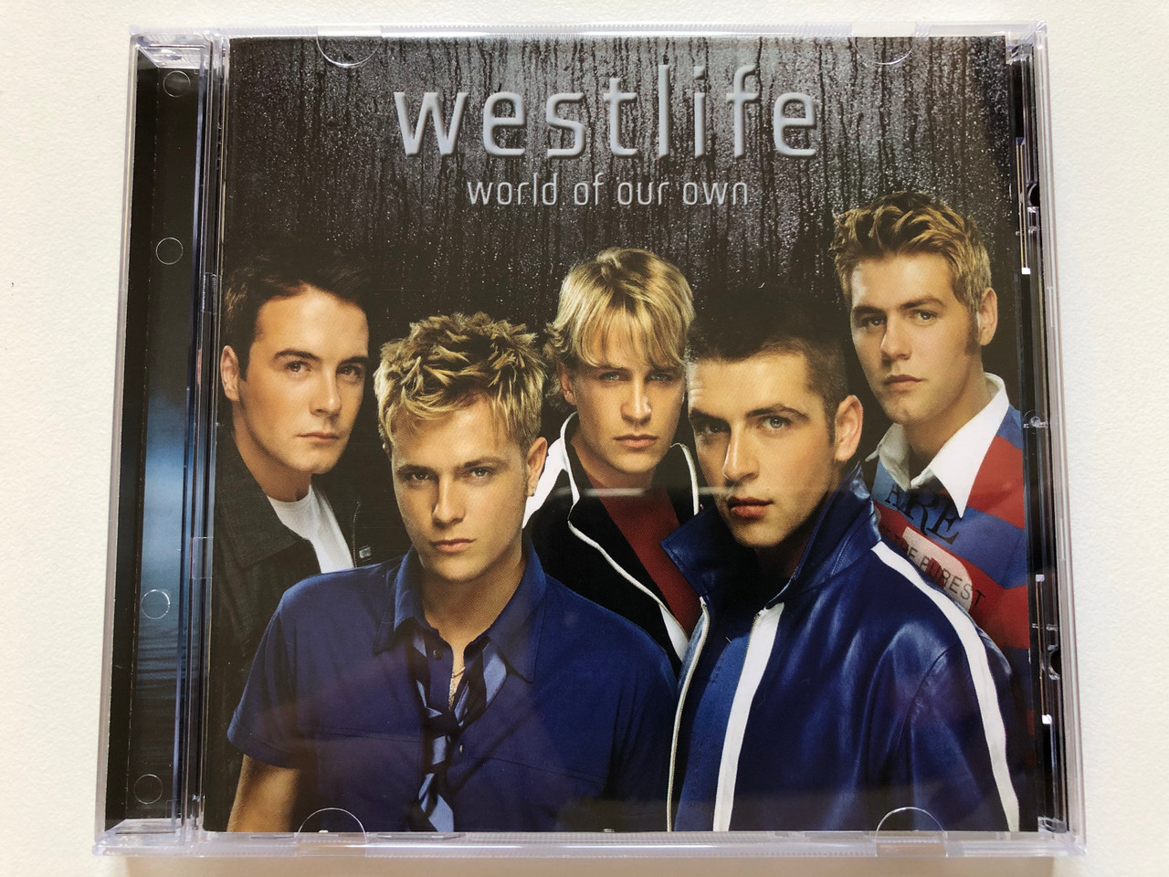 https://cdn10.bigcommerce.com/s-62bdpkt7pb/products/0/images/197887/Westlife_World_Of_Our_Own_RCA_Audio_CD_2001_74321913712_1__10289.1635868703.1280.1280.JPG?c=2&_gl=1*45rgz8*_ga*MjA2NTIxMjE2MC4xNTkwNTEyNTMy*_ga_WS2VZYPC6G*MTYzNTg2NTA1MS4xNTEuMS4xNjM1ODY4NzI1LjYw