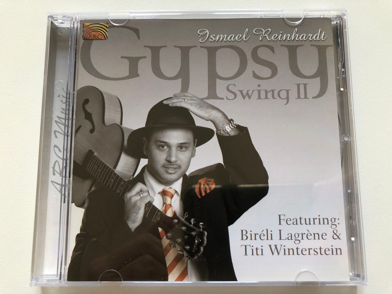 https://cdn10.bigcommerce.com/s-62bdpkt7pb/products/0/images/197935/Ismael_Reinhardt_Gypsy_Swing_II_Featuring_Bireli_Lagrene_Titi_Winterstein_ARC_Music_Audio_CD_2005_EUCD_1958_1__73648.1635873724.1280.1280.JPG?c=2&_gl=1*12ifugq*_ga*MjA2NTIxMjE2MC4xNTkwNTEyNTMy*_ga_WS2VZYPC6G*MTYzNTg2NTA1MS4xNTEuMS4xNjM1ODczNjAyLjM5