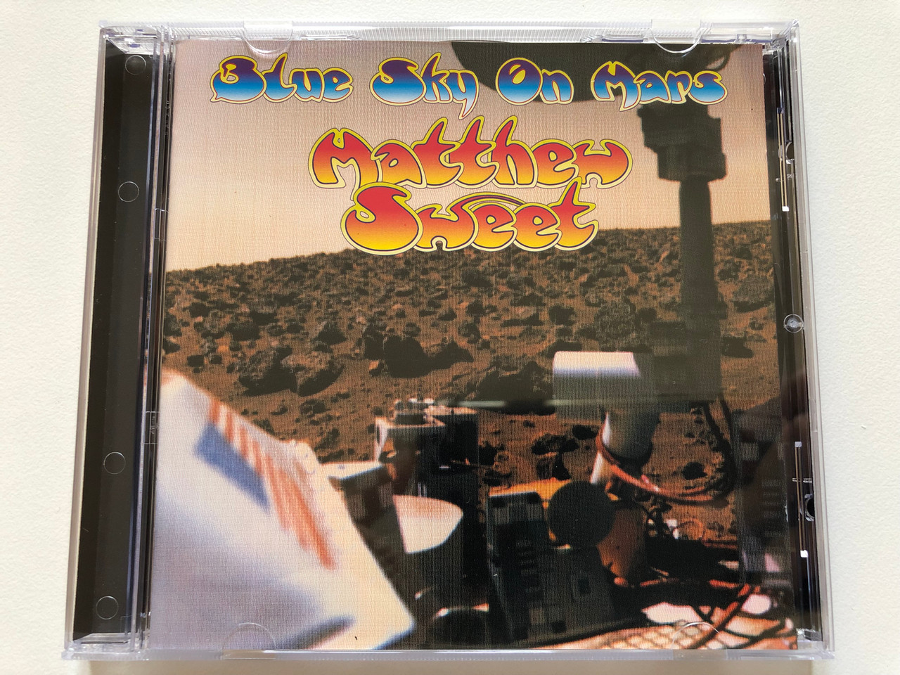 https://cdn10.bigcommerce.com/s-62bdpkt7pb/products/0/images/197962/Blue_Sky_On_Mars_-_Matthew_Sweet_Volcano_Audio_CD_1997_61422_31130_2_1__20085.1635878493.1280.1280.JPG?c=2&_gl=1*1njfhx6*_ga*MjA2NTIxMjE2MC4xNTkwNTEyNTMy*_ga_WS2VZYPC6G*MTYzNTg3Njc0NS4xNTIuMS4xNjM1ODc4NDkxLjYw