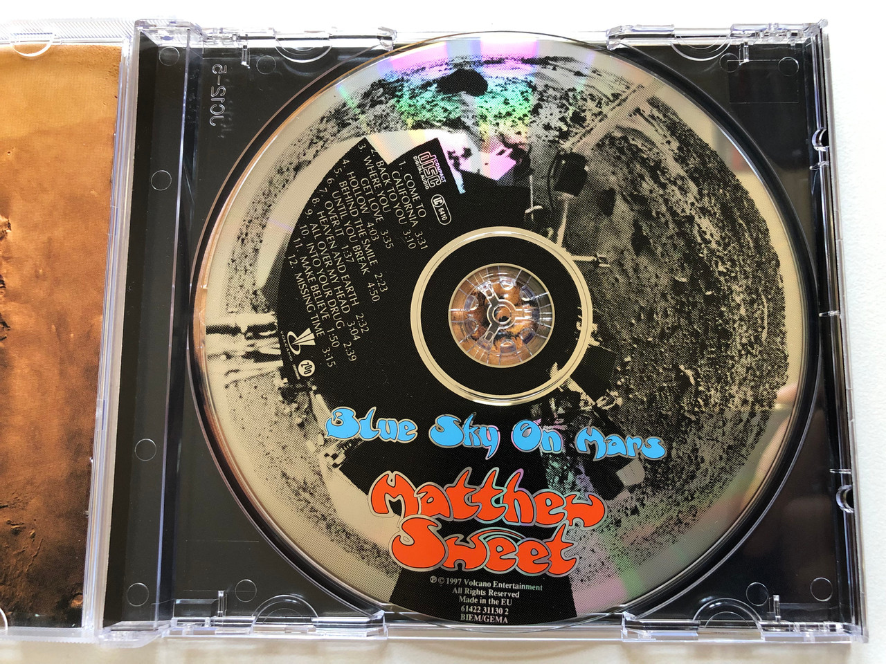 https://cdn10.bigcommerce.com/s-62bdpkt7pb/products/0/images/197963/Blue_Sky_On_Mars_-_Matthew_Sweet_Volcano_Audio_CD_1997_61422_31130_2_3__44723.1635878494.1280.1280.JPG?c=2&_gl=1*1njfhx6*_ga*MjA2NTIxMjE2MC4xNTkwNTEyNTMy*_ga_WS2VZYPC6G*MTYzNTg3Njc0NS4xNTIuMS4xNjM1ODc4NDkxLjYw