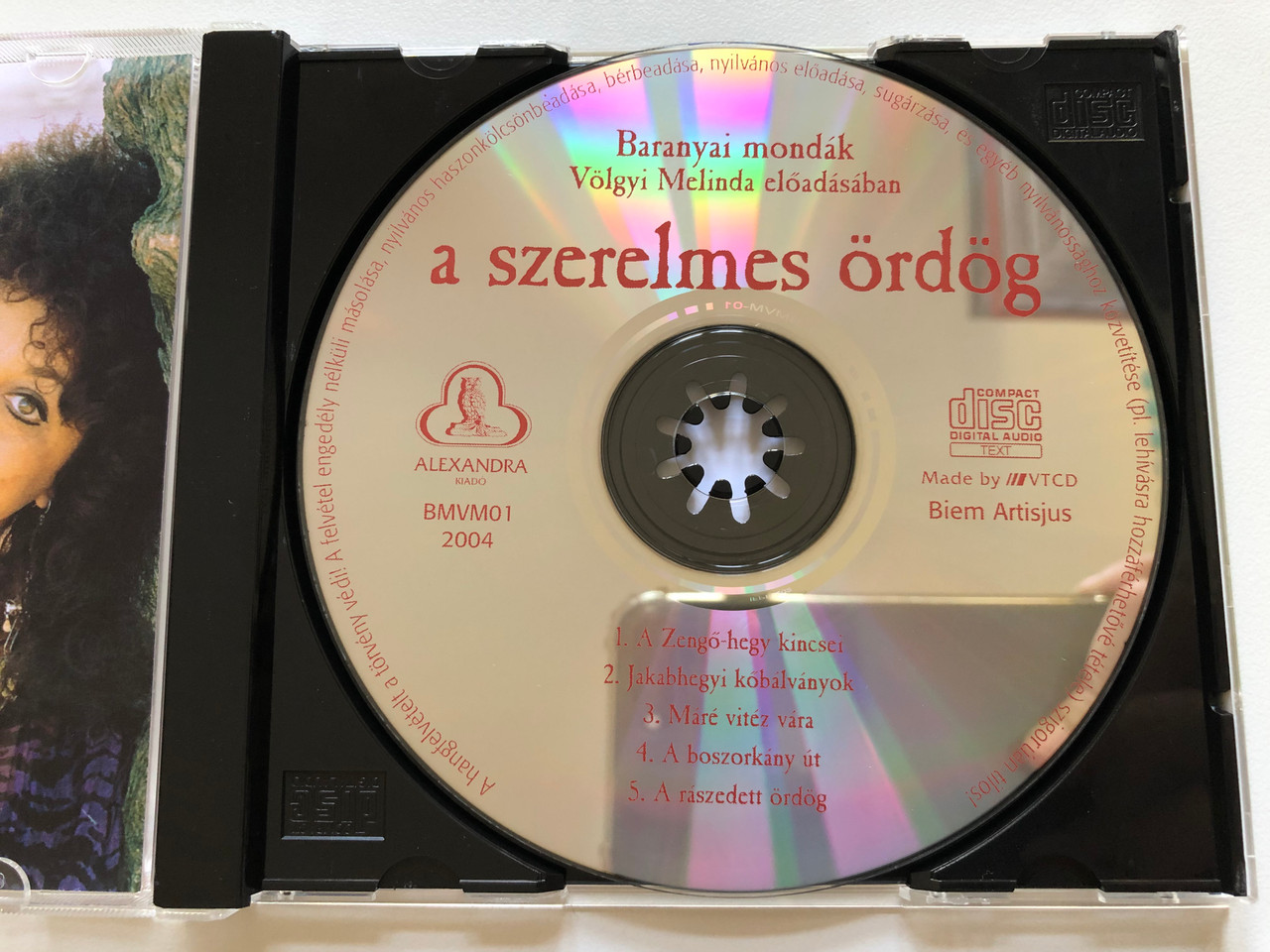 https://cdn10.bigcommerce.com/s-62bdpkt7pb/products/0/images/198029/a_szerelmes_ordog_-_Volgyi_Melinda_eloadasaban_Alexandra_Kiado_Audio_CD_2004_BMVM-01_3__70886.1635924252.1280.1280.JPG?c=2&_gl=1*m9pzdn*_ga*MjA2NTIxMjE2MC4xNTkwNTEyNTMy*_ga_WS2VZYPC6G*MTYzNTkyMjI4Mi4xNTMuMS4xNjM1OTI0MjI1LjYw