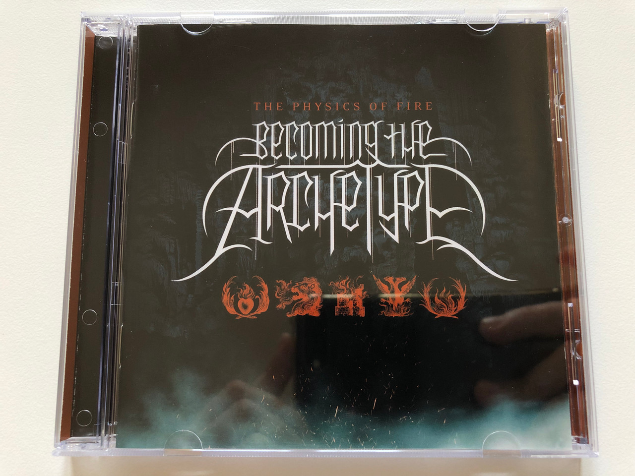 https://cdn10.bigcommerce.com/s-62bdpkt7pb/products/0/images/198075/The_Physics_Of_Fire_-_Becoming_The_Archetype_Century_Media_Audio_CD_2007_33106-2_1__39501.1635931821.1280.1280.JPG?c=2&_gl=1*jbazq3*_ga*MjA2NTIxMjE2MC4xNTkwNTEyNTMy*_ga_WS2VZYPC6G*MTYzNTkyMjI4Mi4xNTMuMS4xNjM1OTMxNTE1LjMy