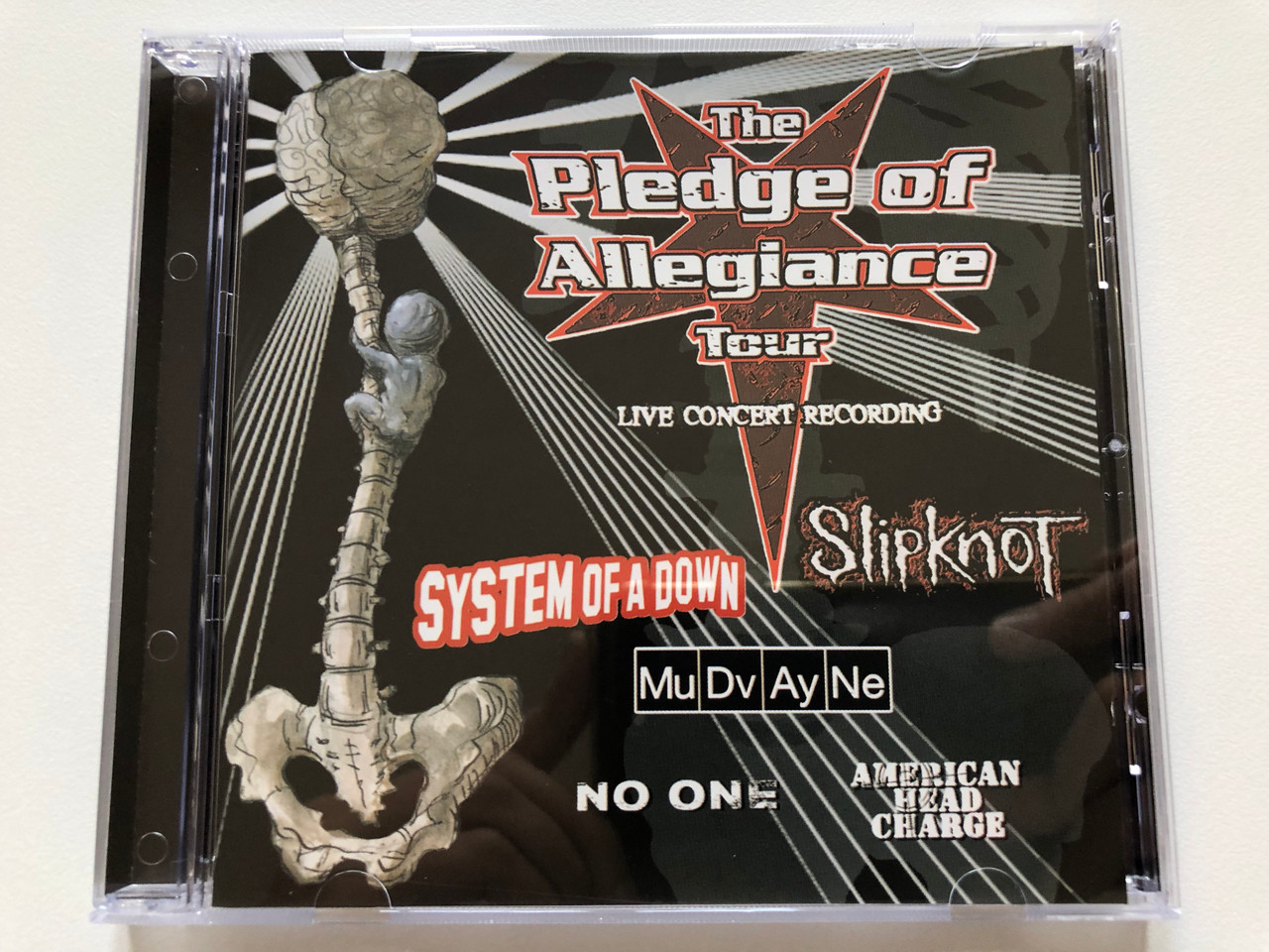 https://cdn10.bigcommerce.com/s-62bdpkt7pb/products/0/images/198169/The_Pledge_Of_Allegiance_Tour_-_Live_Concert_Recording_System_Of_A_Down_Slipknot_Mudvayne_No_One_American_Head_Charge_Columbia_Audio_CD_2002_507959_2_1__07620.1636003611.1280.1280.JPG?c=2&_gl=1*1t4tr8l*_ga*MjA2NTIxMjE2MC4xNTkwNTEyNTMy*_ga_WS2VZYPC6G*MTYzNjAwMjc3Ny4xNTUuMS4xNjM2MDAzNDE3LjQ.
