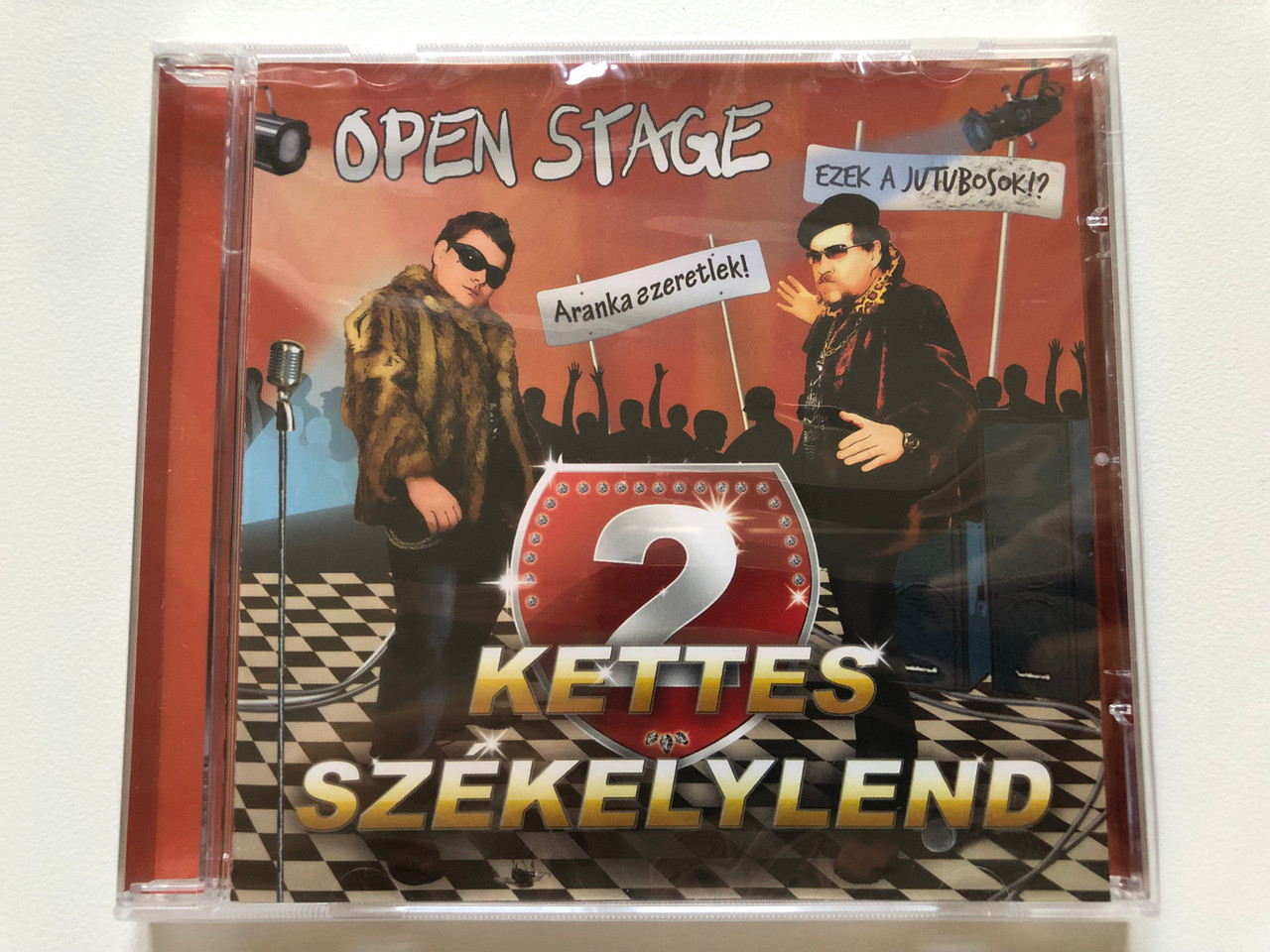 https://cdn10.bigcommerce.com/s-62bdpkt7pb/products/0/images/198203/Open_Stage_2_Kettes_Szkelylend_Retro_Media_Audio_CD_2009_RM824_1__07570.1636006518.1280.1280.JPG?c=2&_gl=1*ohayns*_ga*MjA2NTIxMjE2MC4xNTkwNTEyNTMy*_ga_WS2VZYPC6G*MTYzNjAwMjc3Ny4xNTUuMS4xNjM2MDA2MjczLjU4
