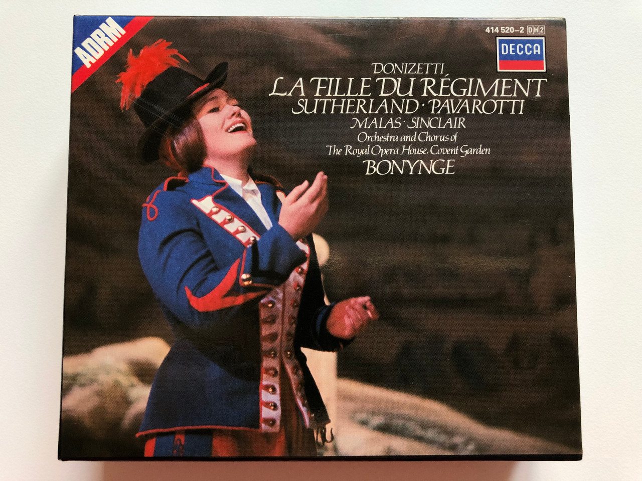 https://cdn10.bigcommerce.com/s-62bdpkt7pb/products/0/images/198261/Donizetti_La_Fille_Du_Rgiment_-_Sutherland_Pavarotti_Malas_Sinclair_Orchestra_And_Chorus_Of_The_Royal_Opera_House_Covent_Garden_Richard_Bonynge_Decca_2x_Audio_CD_Stereo_414_520-2_1__97317.1636025092.1280.1280.JPG?c=2&_gl=1*1gk5fbc*_ga*MjA2NTIxMjE2MC4xNTkwNTEyNTMy*_ga_WS2VZYPC6G*MTYzNjAxOTk1MS4xNTYuMS4xNjM2MDI1MDg4LjYw