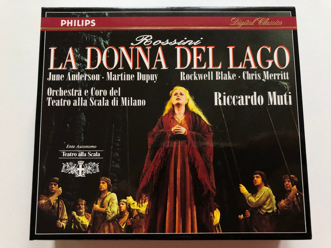 https://cdn10.bigcommerce.com/s-62bdpkt7pb/products/0/images/198370/Rossini_La_Donna_Del_Lago_-_June_Anderson_Martine_Dupuy_Rockwell_Blake_Chris_Merritt_Orchestra_e_Coro_del_Teatro_alla_Scala_di_Milano_Riccardo_Muti_Philips_Classics_2x_Audio_CD_1992_St_1__16653.1636097659.1280.1280.JPG?c=2&_gl=1*1mp3z31*_ga*MjA2NTIxMjE2MC4xNTkwNTEyNTMy*_ga_WS2VZYPC6G*MTYzNjA5MDUyMi4xNTguMS4xNjM2MDk3NDk5LjM2