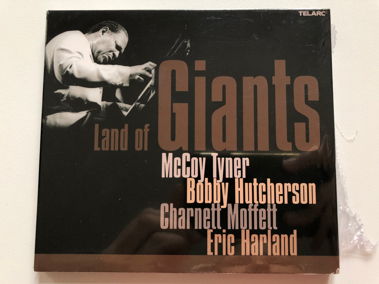 https://cdn10.bigcommerce.com/s-62bdpkt7pb/products/0/images/199040/Land_Of_Giants_-_McCoy_Tyner_Bobby_Hutcherson_Charnett_Moffett_Eric_Harland_Telarc_Audio_CD_2003_CD-83576_1__71846.1636622331.1280.1280.JPG?c=2&_gl=1*15832ho*_ga*MjA2NTIxMjE2MC4xNTkwNTEyNTMy*_ga_WS2VZYPC6G*MTYzNjYyMDM2Ny4xNjUuMS4xNjM2NjIxOTg1LjM4