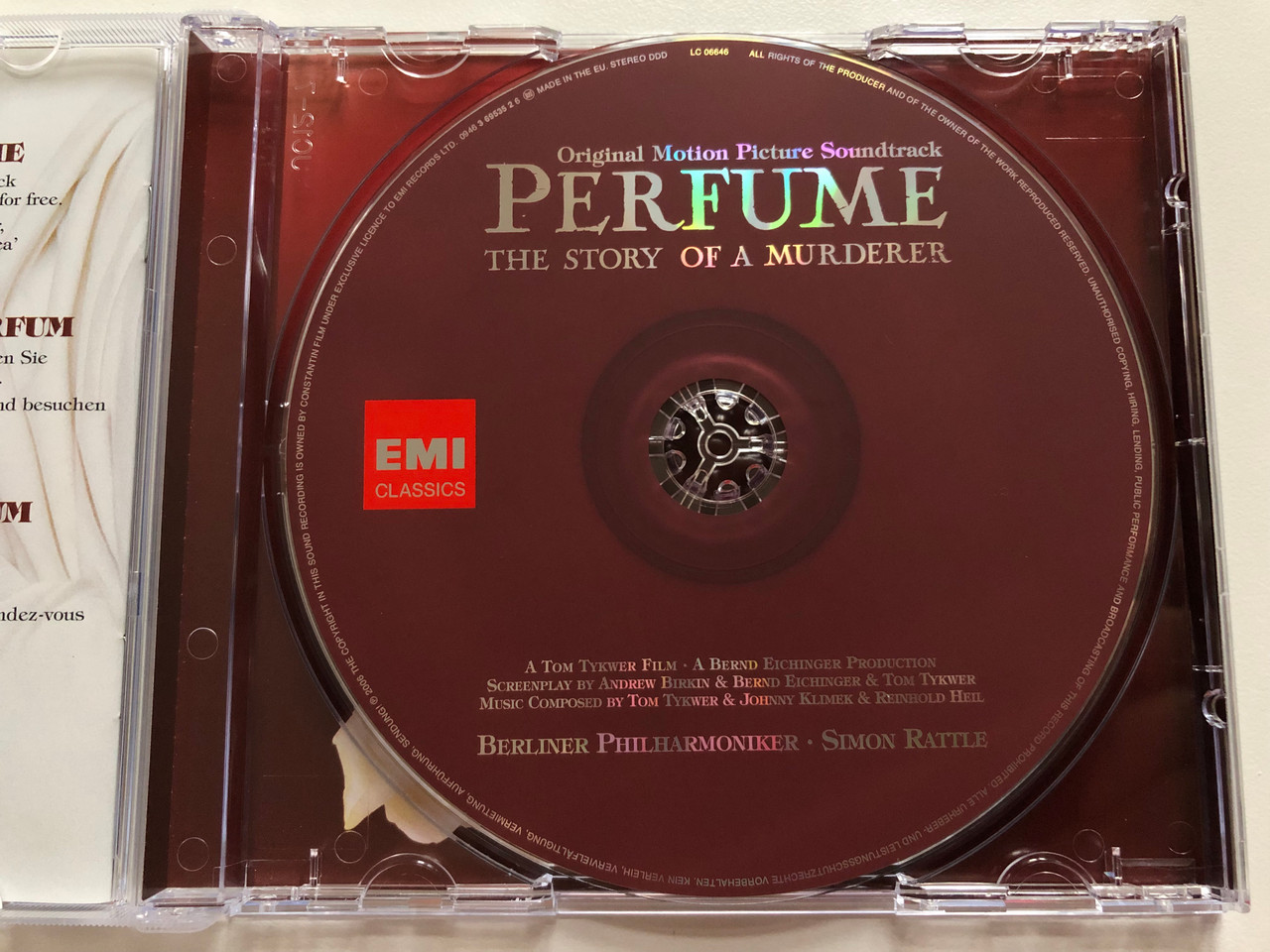 https://cdn10.bigcommerce.com/s-62bdpkt7pb/products/0/images/199214/Perfume_The_Story_Of_A_Murderer_Original_Motion_Picture_Soundtrack_Berliner_Philharmoniker_Simon_Rattle_A_Tom_Tykwer_Film_A_Bernd_Eichinger_Production_EMI_Classics_Audio_CD_2006_0946_3__97162.1636712653.1280.1280.JPG?c=2&_gl=1*12mvvkd*_ga*MjA2NTIxMjE2MC4xNTkwNTEyNTMy*_ga_WS2VZYPC6G*MTYzNjcxMDM2OC4xNjguMS4xNjM2NzEyMzM0LjEz