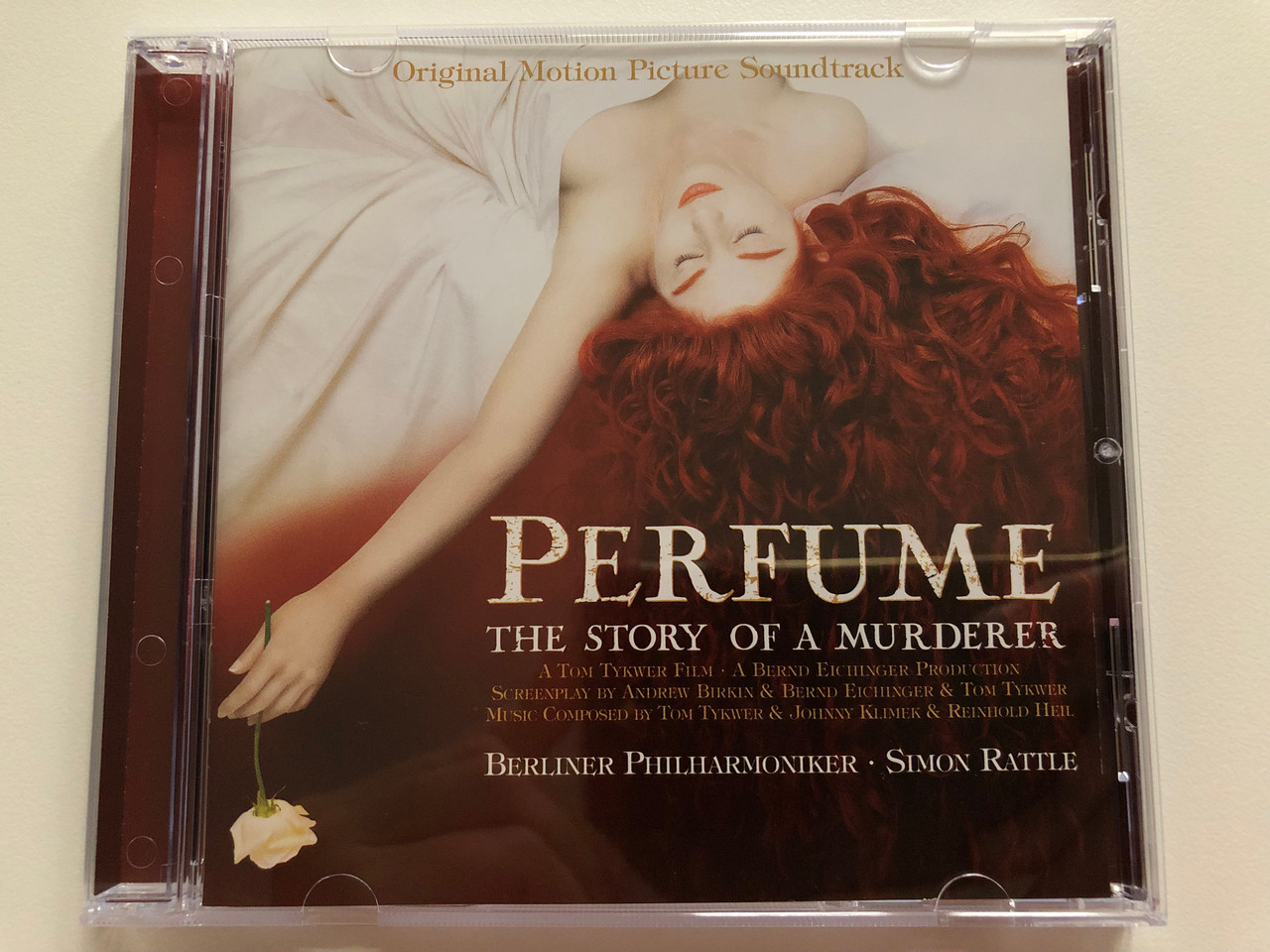 https://cdn10.bigcommerce.com/s-62bdpkt7pb/products/0/images/199215/Perfume_The_Story_Of_A_Murderer_Original_Motion_Picture_Soundtrack_Berliner_Philharmoniker_Simon_Rattle_A_Tom_Tykwer_Film_A_Bernd_Eichinger_Production_EMI_Classics_Audio_CD_2006_094636_1__64554.1636712654.1280.1280.JPG?c=2&_gl=1*sx346q*_ga*MjA2NTIxMjE2MC4xNTkwNTEyNTMy*_ga_WS2VZYPC6G*MTYzNjcxMDM2OC4xNjguMS4xNjM2NzEyMzM0LjEz