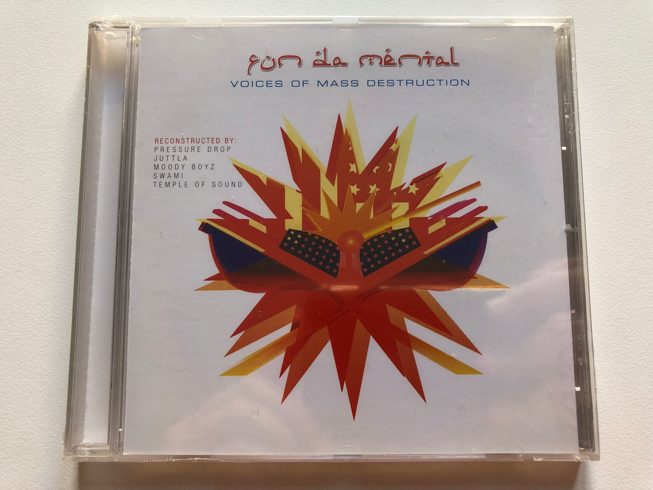 https://cdn10.bigcommerce.com/s-62bdpkt7pb/products/0/images/199628/Fun_Da_Mental_Voices_Of_Mass_Destruction_Reconstructed_by_Pressure_Drop_Juttla_Moody_Boyz_Swam_Temple_Of_Sound_Nocturne_Audio_CD_2003_NTCD144_1__11157.1637254489.1280.1280.JPG?c=2&_gl=1*147ms0q*_ga*MjA2NTIxMjE2MC4xNTkwNTEyNTMy*_ga_WS2VZYPC6G*MTYzNzI0OTk4Ni4xNzUuMS4xNjM3MjU0MDQ2LjQ2