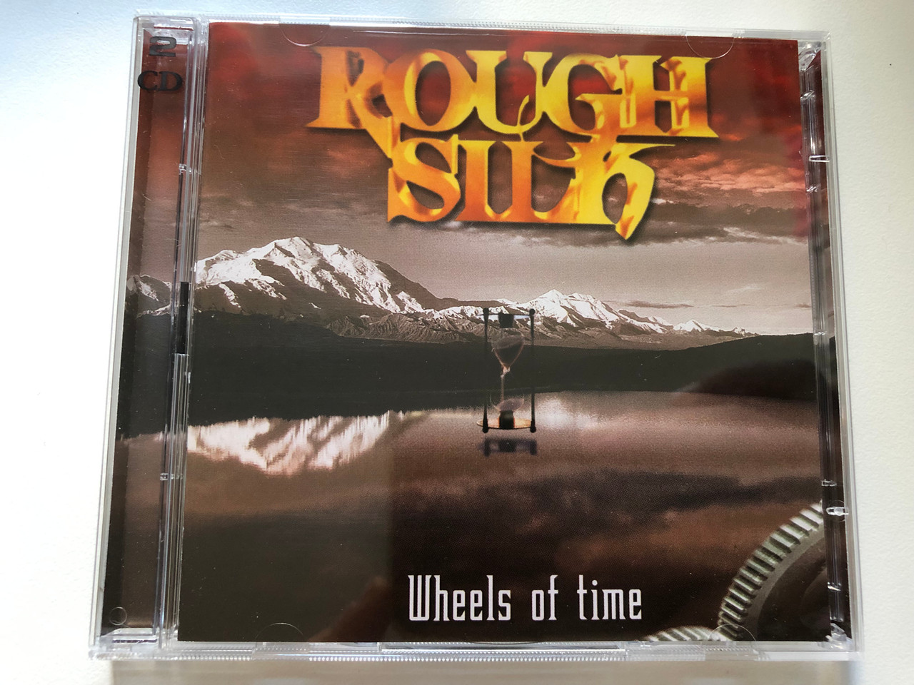https://cdn10.bigcommerce.com/s-62bdpkt7pb/products/0/images/199710/Rough_Silk_Wheels_Of_Time_Massacre_Records_2x_Audio_CD_1999_MAS_CD0219_1__93679.1637326842.1280.1280.JPG?c=2&_gl=1*15uqmj2*_ga*MjA2NTIxMjE2MC4xNTkwNTEyNTMy*_ga_WS2VZYPC6G*MTYzNzMyNTQ5NC4xNzcuMS4xNjM3MzI2NzYwLjQ.