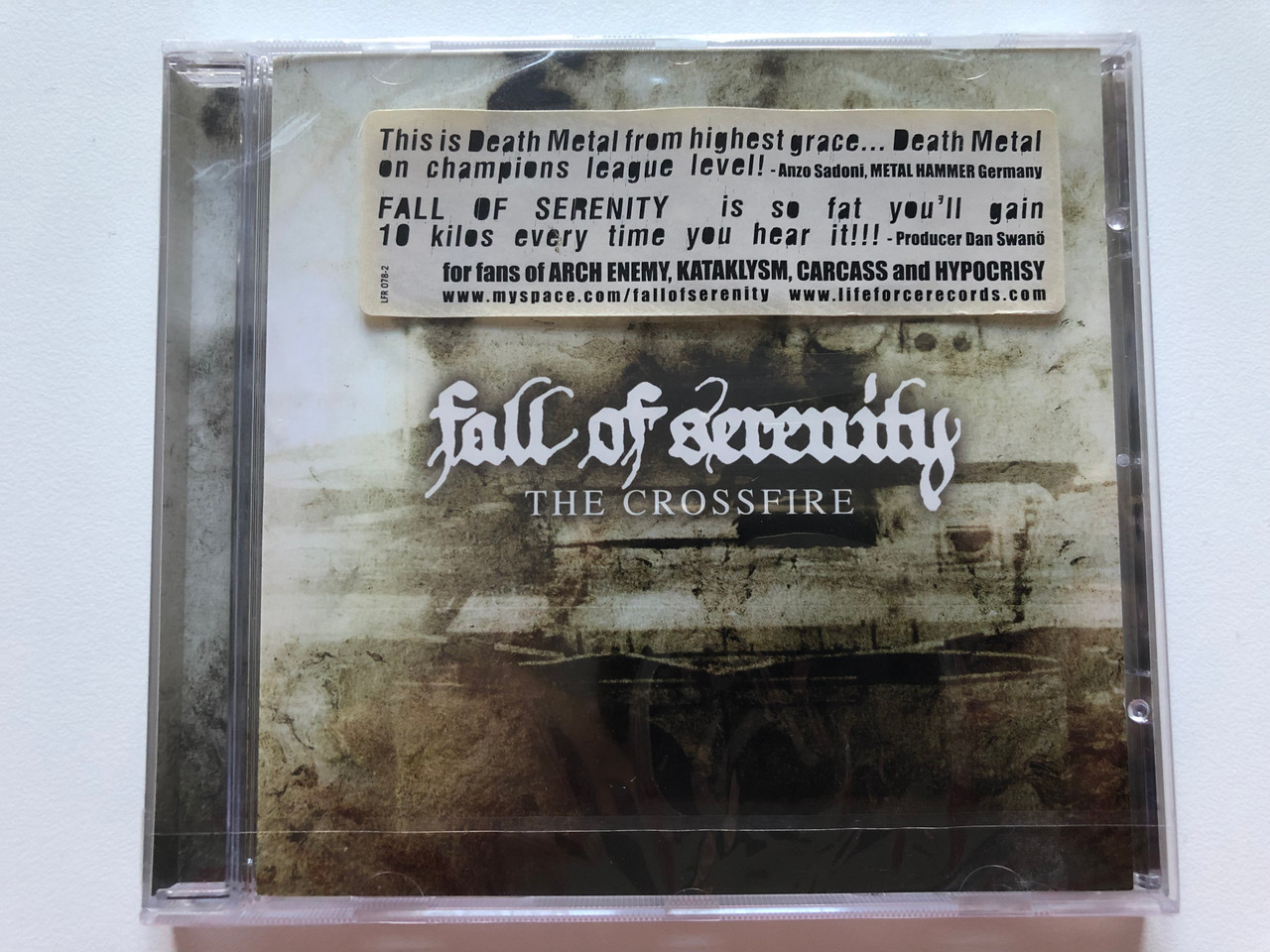 https://cdn10.bigcommerce.com/s-62bdpkt7pb/products/0/images/200068/Fall_Of_Serenity_The_Crossfire_Lifeforce_Records_Audio_CD_2007_LFR_078-2_1__99923.1637650721.1280.1280.JPG?c=2&_gl=1*ohow9*_ga*MjA2NTIxMjE2MC4xNTkwNTEyNTMy*_ga_WS2VZYPC6G*MTYzNzY0ODI3NC4xODAuMS4xNjM3NjUwNjE4LjE3