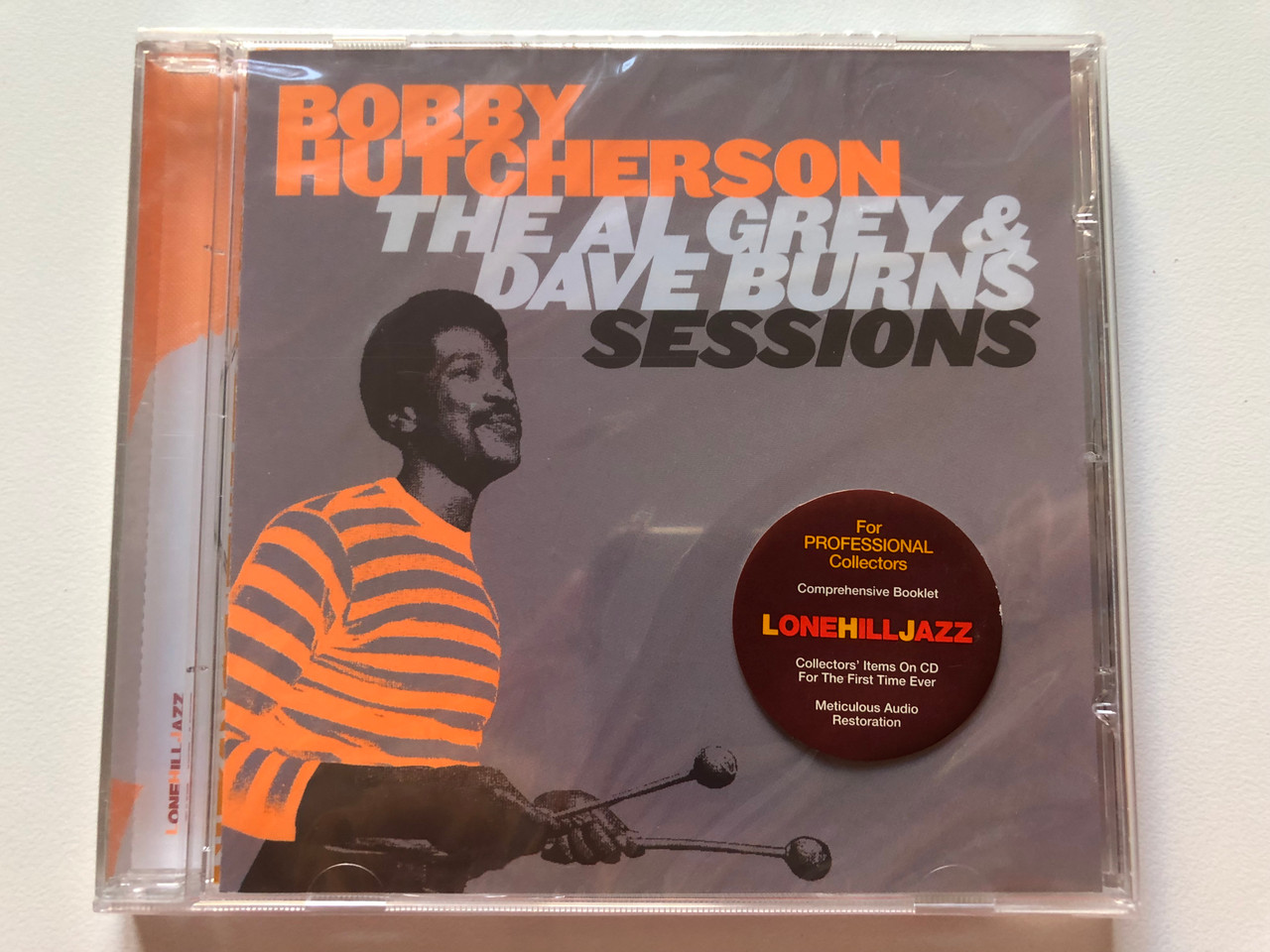 https://cdn10.bigcommerce.com/s-62bdpkt7pb/products/0/images/200074/Bobby_Hutcherson_The_Al_Grey_Dave_Burns_Sessions_For_Professional_Collectors_Lone_Hill_Jazz_Audio_CD_2004_LHJ10137_1__99943.1637651788.1280.1280.JPG?c=2&_gl=1*rev7gj*_ga*MjA2NTIxMjE2MC4xNTkwNTEyNTMy*_ga_WS2VZYPC6G*MTYzNzY0ODI3NC4xODAuMS4xNjM3NjUxNjUwLjU3