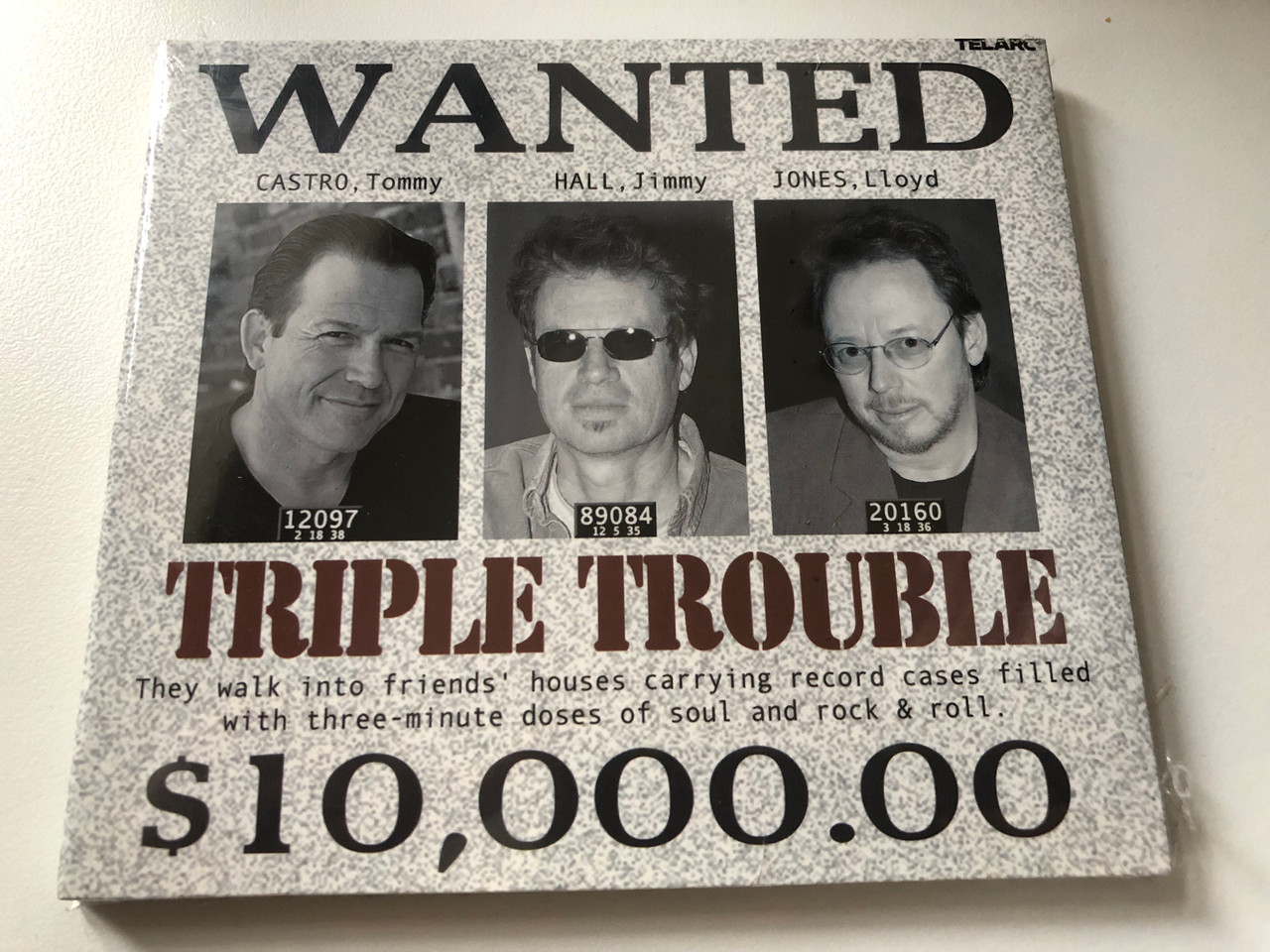https://cdn10.bigcommerce.com/s-62bdpkt7pb/products/0/images/200306/Triple_Trouble_-_Tommy_Castro_Jimmy_Hall_Lloyd_Jones_Telarc_Audio_CD_2003_CD-83585_1__48691.1637745458.1280.1280.JPG?c=2&_gl=1*xv9brc*_ga*MjA2NTIxMjE2MC4xNTkwNTEyNTMy*_ga_WS2VZYPC6G*MTYzNzczNjc0MC4xODQuMS4xNjM3NzQ1MTM2LjQw