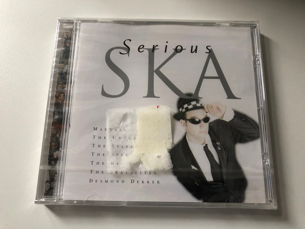 https://cdn10.bigcommerce.com/s-62bdpkt7pb/products/0/images/200325/Serious_Ska_Madness_The_Untouchables_The_Selecter_The_Specials_The_Beat_The_Skatalites_Desmond_Dekker_EMI_Plus_Audio_CD_2000_724357605823_1__80727.1637752647.1280.1280.JPG?c=2&_gl=1*y2othb*_ga*MjA2NTIxMjE2MC4xNTkwNTEyNTMy*_ga_WS2VZYPC6G*MTYzNzc1MTUzMi4xODUuMS4xNjM3NzUyNDgyLjEy