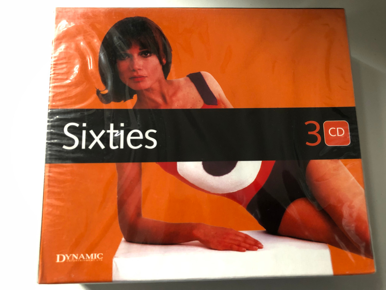 https://cdn10.bigcommerce.com/s-62bdpkt7pb/products/0/images/200415/Sixties_Dynamic_Entertainment_Ltd_3x_Audio_CD_2004_DYN_3113_1__83787.1637839815.1280.1280.JPG?c=2&_gl=1*9tvklu*_ga*MjA2NTIxMjE2MC4xNTkwNTEyNTMy*_ga_WS2VZYPC6G*MTYzNzgzODk5Mi4xODcuMS4xNjM3ODM5NzEwLjU3