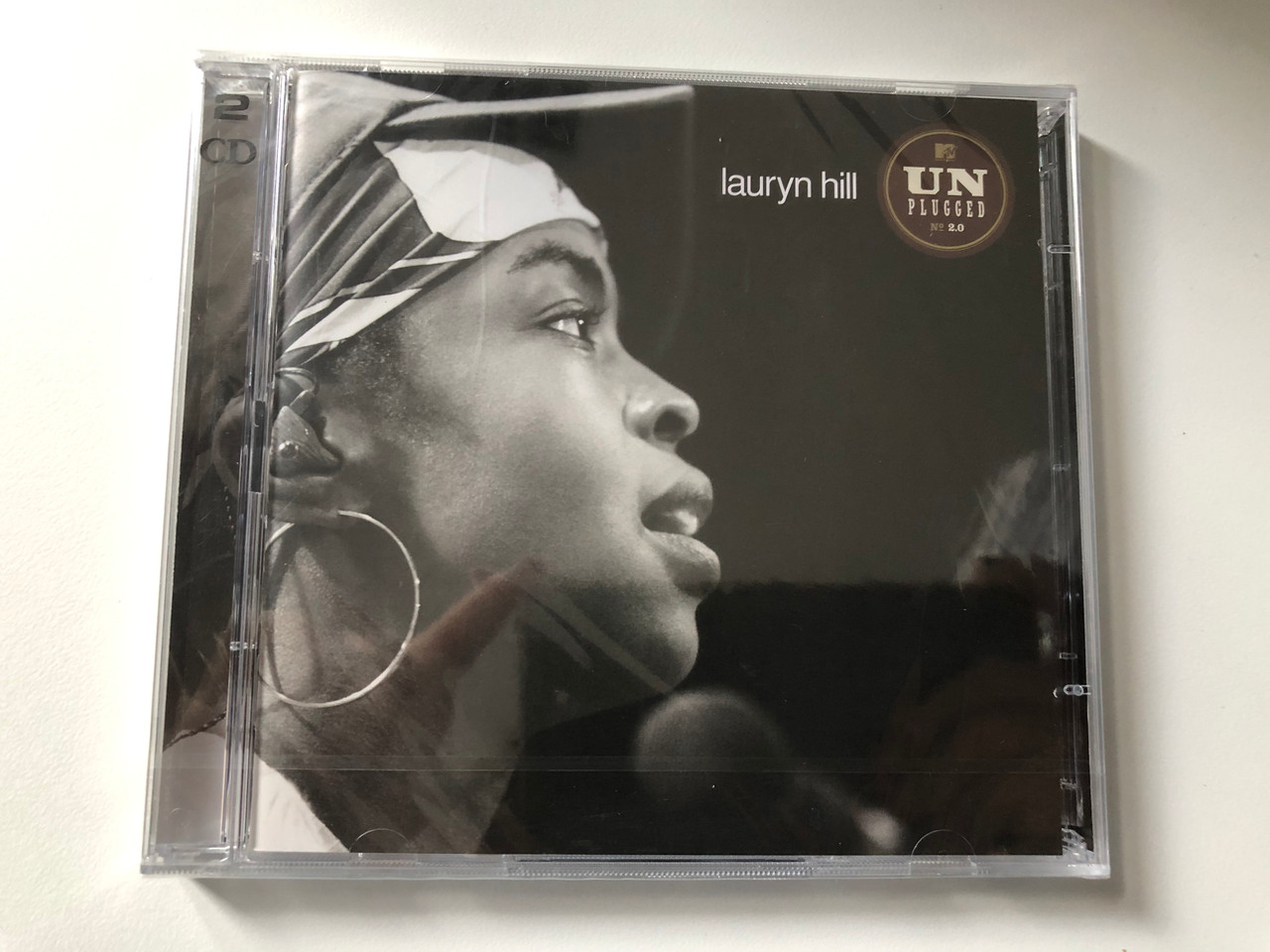 https://cdn10.bigcommerce.com/s-62bdpkt7pb/products/0/images/200444/Lauryn_Hill_MTV_Unplugged_2.0_Columbia_2x_Audio_CD_2002_508003_2_1__93281.1637854044.1280.1280.JPG?c=2&_gl=1*15qxga3*_ga*MjA2NTIxMjE2MC4xNTkwNTEyNTMy*_ga_WS2VZYPC6G*MTYzNzg1MjczMi4xODkuMS4xNjM3ODUzNzgwLjUy