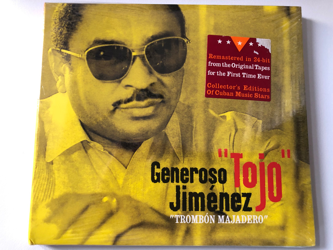 https://cdn10.bigcommerce.com/s-62bdpkt7pb/products/0/images/200448/Generoso_Tojo_Jimnez_Trombn_Majadero_Remastered_in_24-bit_from_the_Original_Tapes_for_the_First_Time_Ever_Collectors_Editions_Of_Cuban_Music_Stars_Malanga_Music_Audio_CD_2007_MM_1__76054.1637854630.1280.1280.JPG?c=2&_gl=1*159lcht*_ga*MjA2NTIxMjE2MC4xNTkwNTEyNTMy*_ga_WS2VZYPC6G*MTYzNzg1MjczMi4xODkuMS4xNjM3ODU0MzY2LjEy
