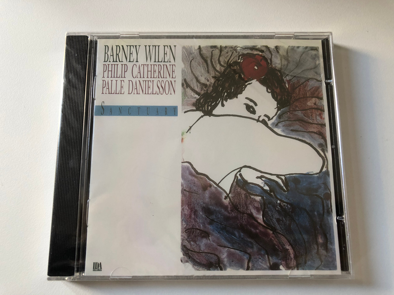 https://cdn10.bigcommerce.com/s-62bdpkt7pb/products/0/images/200610/Barney_Wilen_Sanctuary_-_Philip_Catherine_Palle_Danielsson_IDA_Records_Audio_CD_1991_IDA_029_CD_1__66303.1638173444.1280.1280.JPG?c=2&_gl=1*1fs4inc*_ga*MjA2NTIxMjE2MC4xNTkwNTEyNTMy*_ga_WS2VZYPC6G*MTYzODE3MTM4NC4xOTMuMS4xNjM4MTczMjUxLjIy