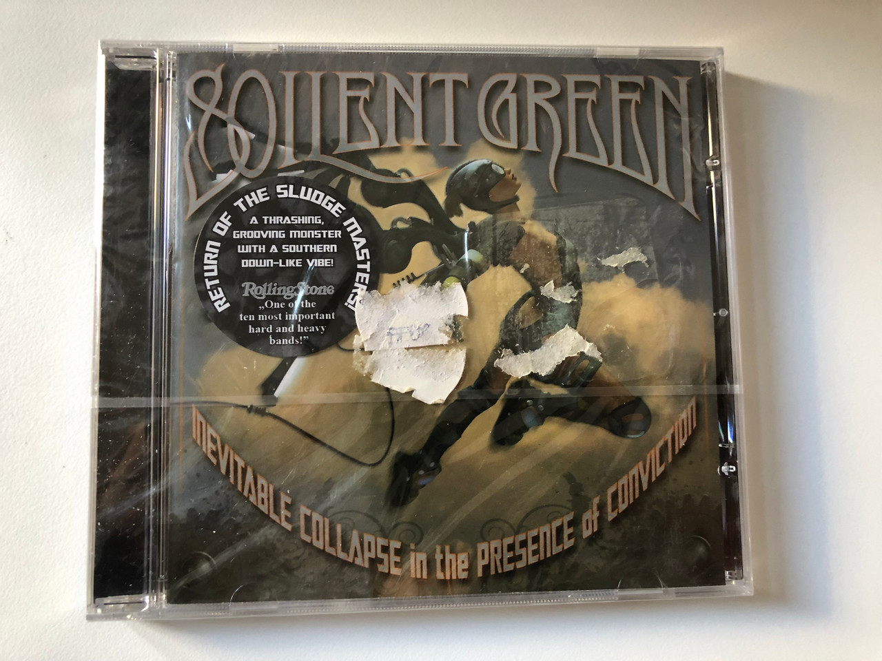 https://cdn10.bigcommerce.com/s-62bdpkt7pb/products/0/images/200663/Soilent_Green_Inevitable_Collapse_In_The_Presence_Of_Conviction_Metal_Blade_Records_Audio_CD_2008_3984-14665-2_1__18686.1638186899.1280.1280.JPG?c=2&_gl=1*1pq8y0c*_ga*MjA2NTIxMjE2MC4xNTkwNTEyNTMy*_ga_WS2VZYPC6G*MTYzODE3MTM4NC4xOTMuMS4xNjM4MTg2MTM4LjQy