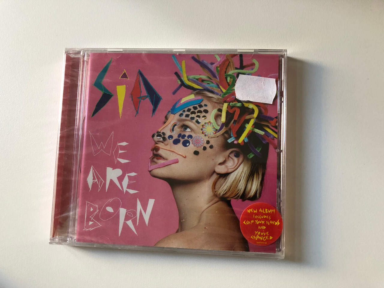 https://cdn10.bigcommerce.com/s-62bdpkt7pb/products/0/images/200745/Sia_We_Are_Born_New_Album_Includes_Clap_Your_Hands_And_Youve_Changed_Sony_Music_Audio_CD_2010_88697694122_1__32154.1638270792.1280.1280.JPG?c=2&_gl=1*z1crr*_ga*MjA2NTIxMjE2MC4xNTkwNTEyNTMy*_ga_WS2VZYPC6G*MTYzODI2OTM4NC4xOTUuMS4xNjM4MjcwMTE2LjU4