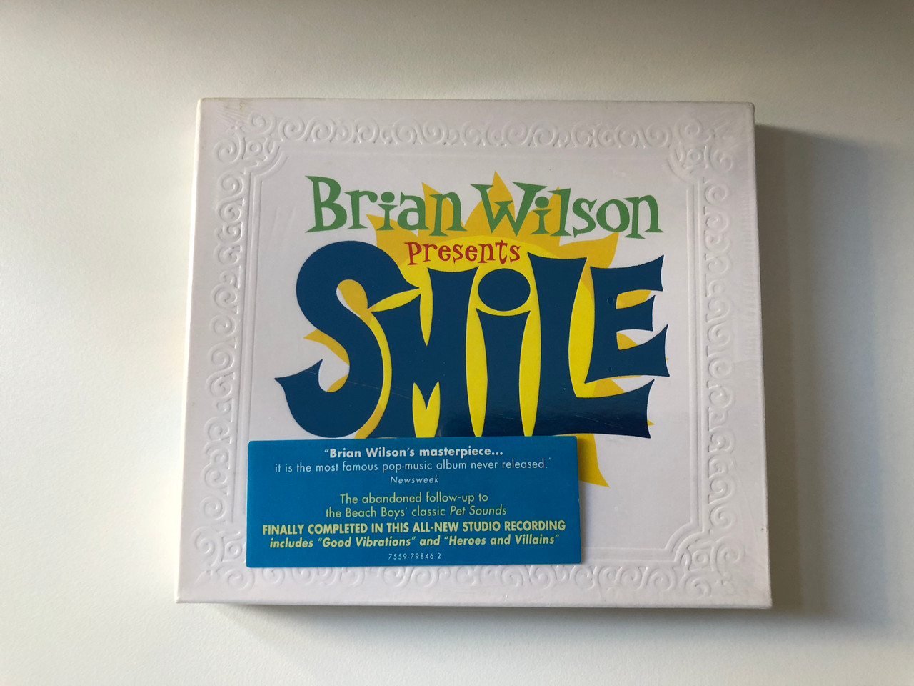 https://cdn10.bigcommerce.com/s-62bdpkt7pb/products/0/images/200815/Brian_Wilson_Presents_-_Smile_Finally_Completed_In_This_All-New_Studio_Recording_includes_Good_Vibraions_and_Heroes_and_Villians_Nonesuch_Audio_CD_7559-79846-2_1__01323.1638342771.1280.1280.JPG?c=2&_gl=1*1m3n20r*_ga*MjA2NTIxMjE2MC4xNTkwNTEyNTMy*_ga_WS2VZYPC6G*MTYzODM0MTY0MS4xOTcuMS4xNjM4MzQyMzc2LjE5
