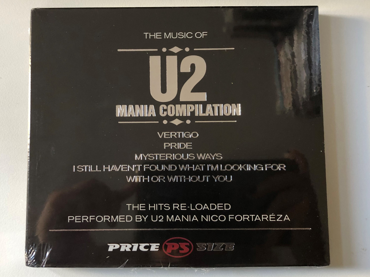 https://cdn10.bigcommerce.com/s-62bdpkt7pb/products/0/images/200830/The_Music_Of_U2_Mania_Compilation_-_Vertigo_Pride_Mysterious_Ways_I_Still_Havent_Found_What_Im_Looking_For_With_Or_Without_You_The_Hits_Re-Loaded_Performed_By_U2_Mania_Nico_Fortarza_1__19932.1638346645.1280.1280.JPG?c=2&_gl=1*1sfvov3*_ga*MjA2NTIxMjE2MC4xNTkwNTEyNTMy*_ga_WS2VZYPC6G*MTYzODM0MTY0MS4xOTcuMS4xNjM4MzQ2Mzc3LjU5
