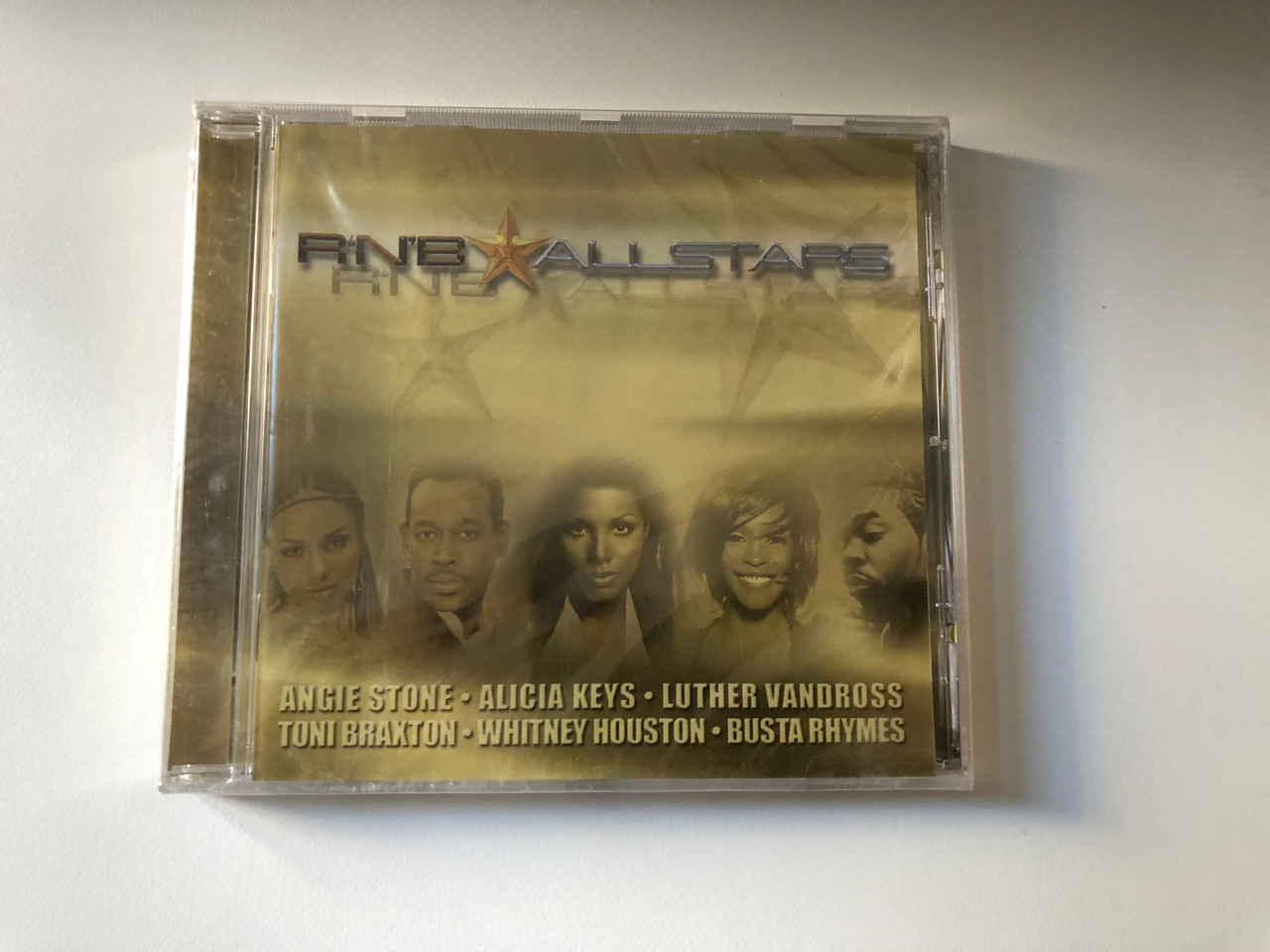 https://cdn10.bigcommerce.com/s-62bdpkt7pb/products/0/images/200861/RNB_All_Stars_Angie_Stone_Alicia_Keys_Luther_Vandross_Toni_Braxton_Whitney_Houston_Busta_Rhymes_BMG_Audio_CD_2003_74321_98375_2_1__89330.1638354120.1280.1280.JPG?c=2&_gl=1*p4p8vy*_ga*MjA2NTIxMjE2MC4xNTkwNTEyNTMy*_ga_WS2VZYPC6G*MTYzODM0MTY0MS4xOTcuMS4xNjM4MzUzOTA0LjQy