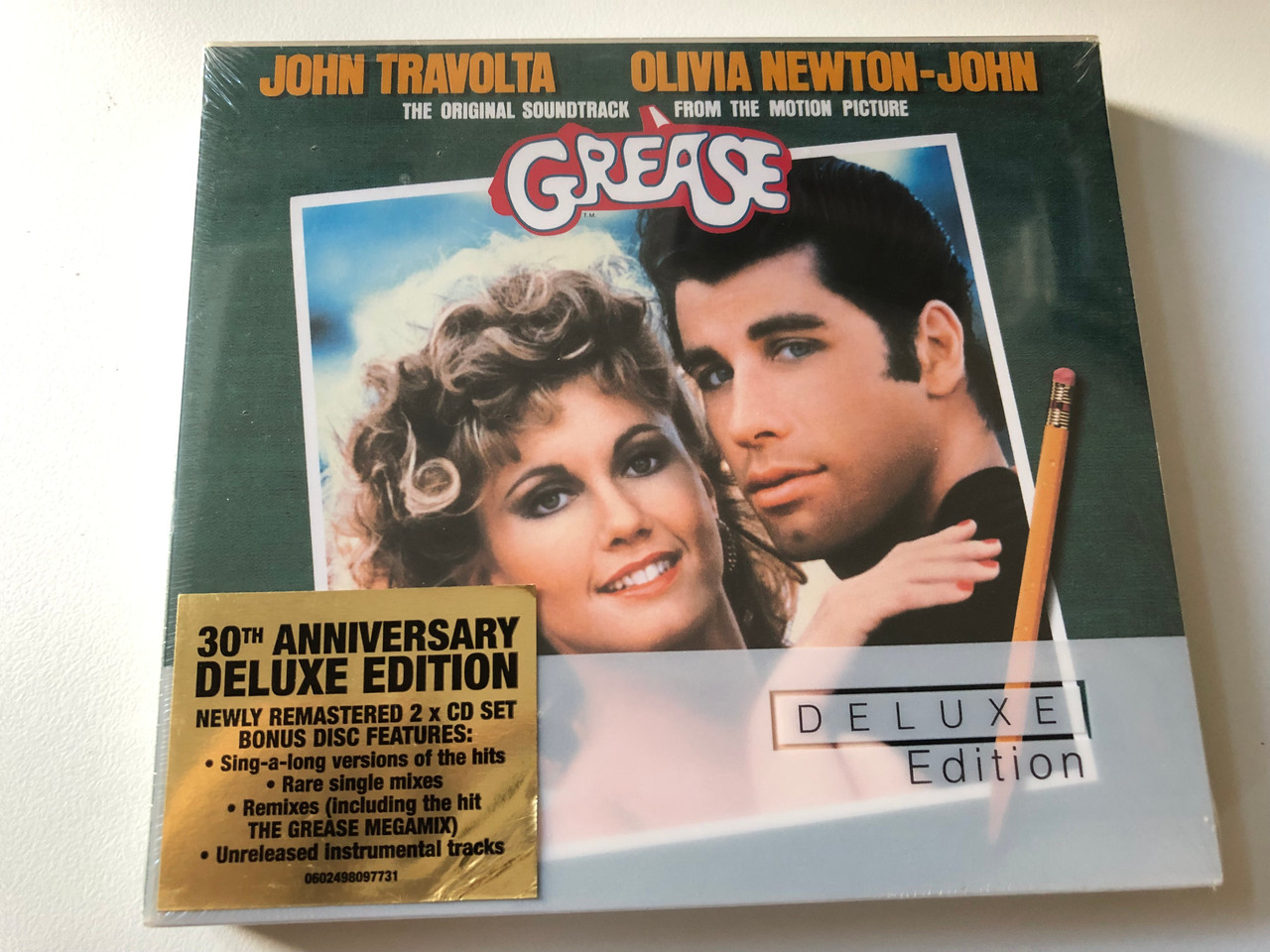 https://cdn10.bigcommerce.com/s-62bdpkt7pb/products/0/images/200932/Grease_The_Original_Soundtrack_From_The_Motion_Picture_-_John_Travolta_Olivia_Newton-John_Deluxe_Edition_30th_Anniversary_Deluxe_Edition_Polydor_2x_Audio_CD_2003_B0001011-02_1__72446.1638441299.1280.1280.JPG?c=2&_gl=1*4b47n*_ga*MjA2NTIxMjE2MC4xNTkwNTEyNTMy*_ga_WS2VZYPC6G*MTYzODQ0MDM5Mi4xOTkuMS4xNjM4NDQxMDgwLjQx