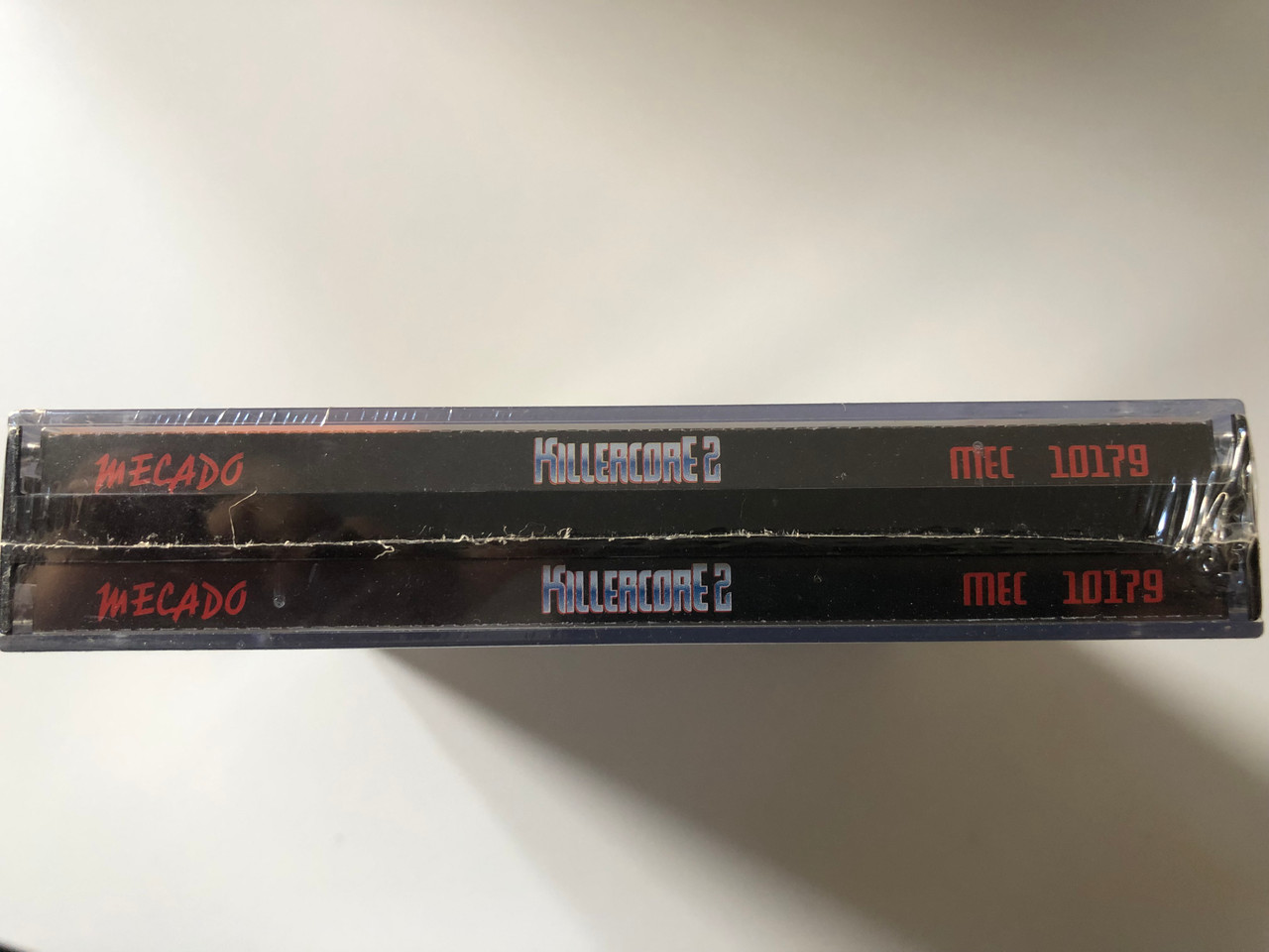 https://cdn10.bigcommerce.com/s-62bdpkt7pb/products/0/images/200955/Killercore_2_Rizn_From_Its_Grave_To_Haunt_You_MECADO_2x_Audio_CD_1997_MEC_10179_4__36708.1638445592.1280.1280.JPG?c=2&_gl=1*1rxa7bw*_ga*MjA2NTIxMjE2MC4xNTkwNTEyNTMy*_ga_WS2VZYPC6G*MTYzODQ0MDM5Mi4xOTkuMS4xNjM4NDQ1MTc5LjIy