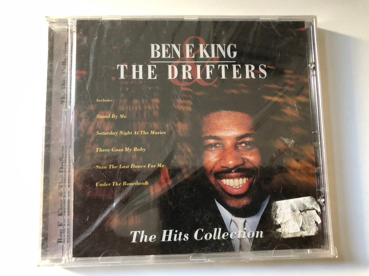 https://cdn10.bigcommerce.com/s-62bdpkt7pb/products/0/images/200981/Ben_E._King_The_Drifters_The_Hits_Collection_Includes_Stand_By_Me_Saturday_Night_At_The_Movies_There_Goes_My_Baby_Save_The_Last_Dance_For_Me_Under_The_Boardwalk_CMC_Home_Entertainme_1__50281.1638450264.1280.1280.JPG?c=2&_gl=1*mwyy3z*_ga*MjA2NTIxMjE2MC4xNTkwNTEyNTMy*_ga_WS2VZYPC6G*MTYzODQ0MDM5Mi4xOTkuMS4xNjM4NDUwMjUwLjYw