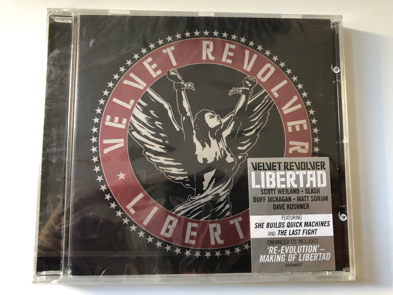 https://cdn10.bigcommerce.com/s-62bdpkt7pb/products/0/images/201018/Velvet_Revolver_Libertad_Scott_Weiland_Slash_Duff_McKagan_Matt_Sorum_Dave_Kushner_Featuring_She_Builds_Quick_Machines_and_The_Last_Fight._Enhanced_CD_Includes_Re-Evolution_RCA_Audi_1__88719.1638520841.1280.1280.JPG?c=2&_gl=1*4964zy*_ga*MjA2NTIxMjE2MC4xNTkwNTEyNTMy*_ga_WS2VZYPC6G*MTYzODUxNDM5NC4yMDAuMS4xNjM4NTE5NTE2LjU5