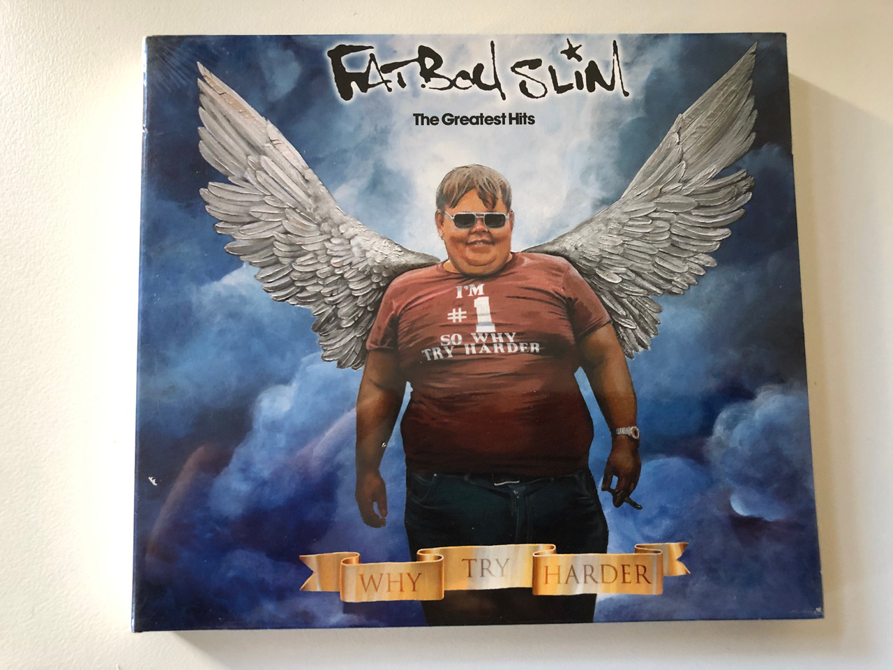 https://cdn10.bigcommerce.com/s-62bdpkt7pb/products/0/images/201074/Fatboy_Slim_The_Greatest_Hits_-_Why_Try_Harder_Skint_Audio_CD_DVD_CD_2006_Brassic40CDL_1__24642.1638793919.1280.1280.JPG?c=2&_gl=1*jel0i9*_ga*MjA2NTIxMjE2MC4xNTkwNTEyNTMy*_ga_WS2VZYPC6G*MTYzODc5MjgxOC4yMDIuMS4xNjM4NzkzNjE1LjMw