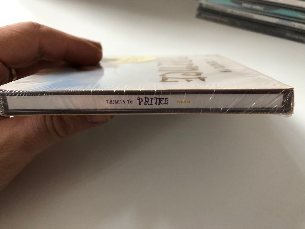 https://cdn10.bigcommerce.com/s-62bdpkt7pb/products/0/images/201136/A_Tribute_To_Prince_Featuring_Ice-T_Heaven_17_Rebecca_Romijn_and_manz_others_artists_Remedy_Audio_CD_2000_3055672_4__64802.1638819936.1280.1280.JPG?c=2&_gl=1*h9yb9g*_ga*MjA2NTIxMjE2MC4xNTkwNTEyNTMy*_ga_WS2VZYPC6G*MTYzODgxOTE0NS4yMDMuMS4xNjM4ODE5NzQxLjU4