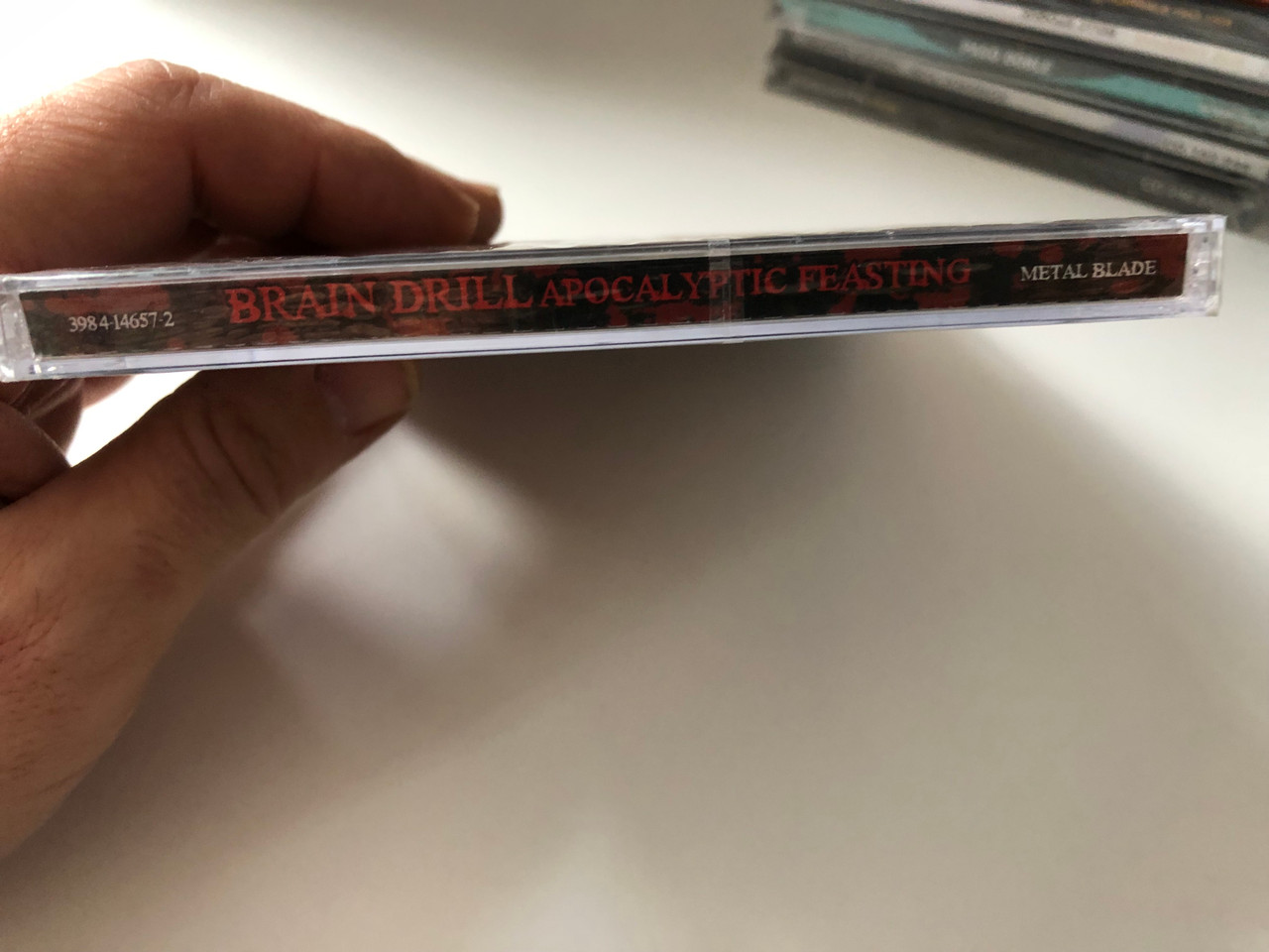 https://cdn10.bigcommerce.com/s-62bdpkt7pb/products/0/images/201141/Brain_Drill_Apocalyptic_Feasting_Metal_Blade_Records_Audio_CD_2008_3984-14657-2_3__07501.1638820336.1280.1280.JPG?c=2&_gl=1*9f7gzf*_ga*MjA2NTIxMjE2MC4xNTkwNTEyNTMy*_ga_WS2VZYPC6G*MTYzODgxOTE0NS4yMDMuMS4xNjM4ODIwMTM2LjI3