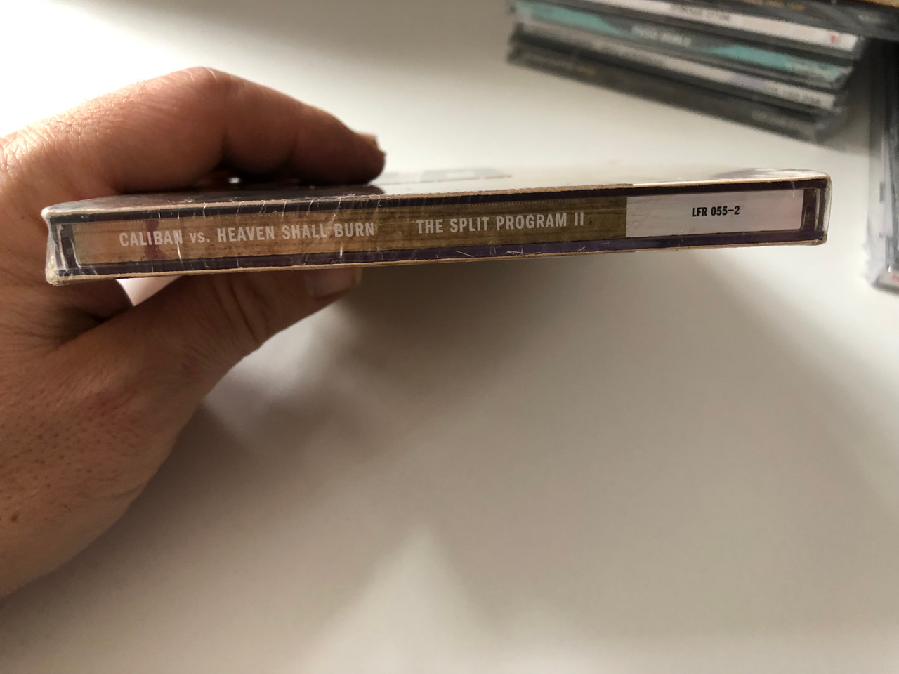 https://cdn10.bigcommerce.com/s-62bdpkt7pb/products/0/images/201149/Caliban_vs_Heaven_Shall_Burn_The_Split_Program_II_Lifeforce_Records_Audio_CD_2005_LFR_055-2_4__30294.1638820995.1280.1280.JPG?c=2&_gl=1*1hsm1v4*_ga*MjA2NTIxMjE2MC4xNTkwNTEyNTMy*_ga_WS2VZYPC6G*MTYzODgxOTE0NS4yMDMuMS4xNjM4ODIwODc4Ljc.