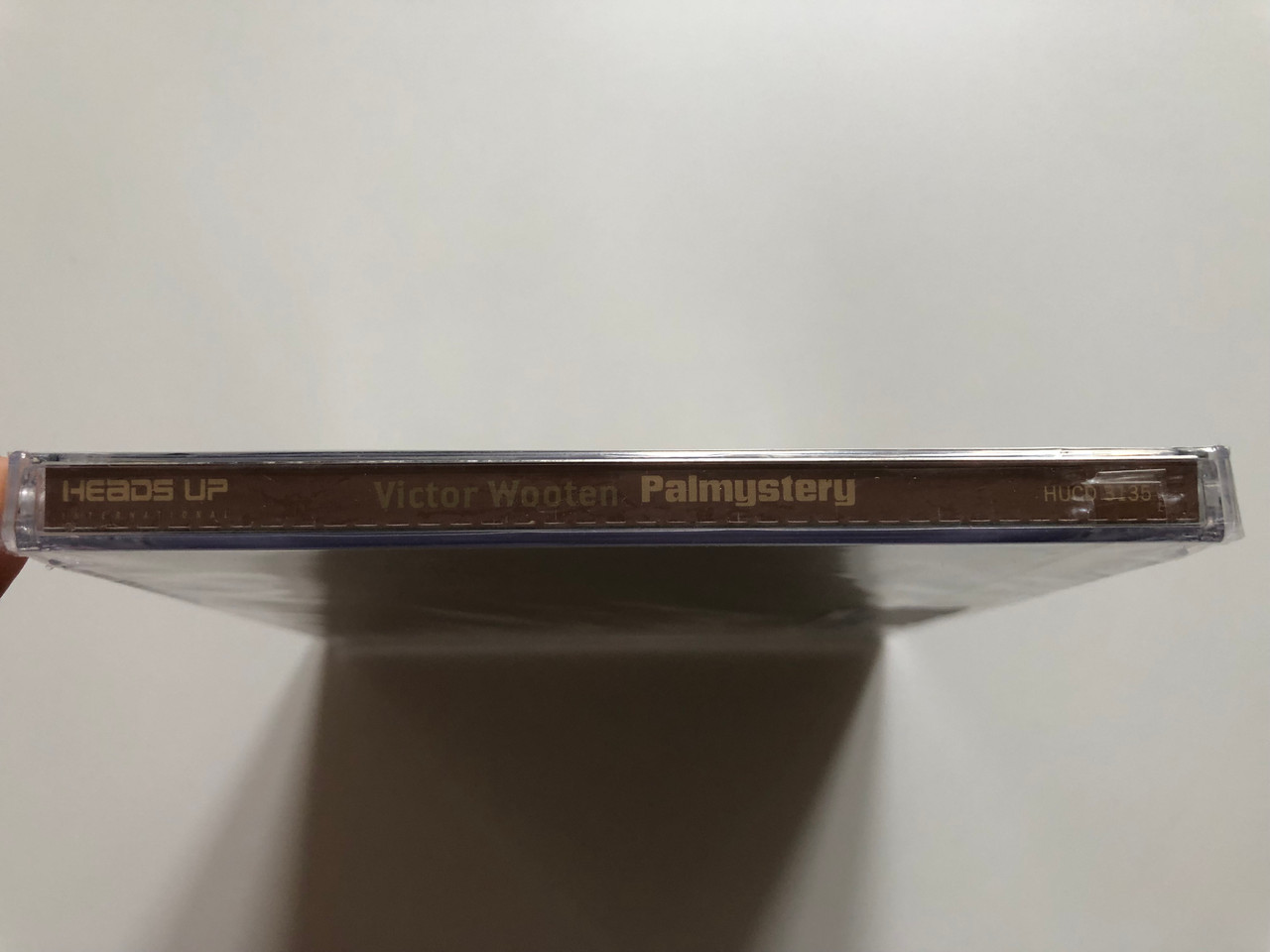https://cdn10.bigcommerce.com/s-62bdpkt7pb/products/0/images/201194/Victor_Wooten_Palmystery_Heads_Up_International_Audio_CD_2008_HUCD_3135_3__67186.1638898806.1280.1280.JPG?c=2&_gl=1*1anr5f6*_ga*MjA2NTIxMjE2MC4xNTkwNTEyNTMy*_ga_WS2VZYPC6G*MTYzODg5MjM0OC4yMDUuMS4xNjM4ODk4NzEzLjc.