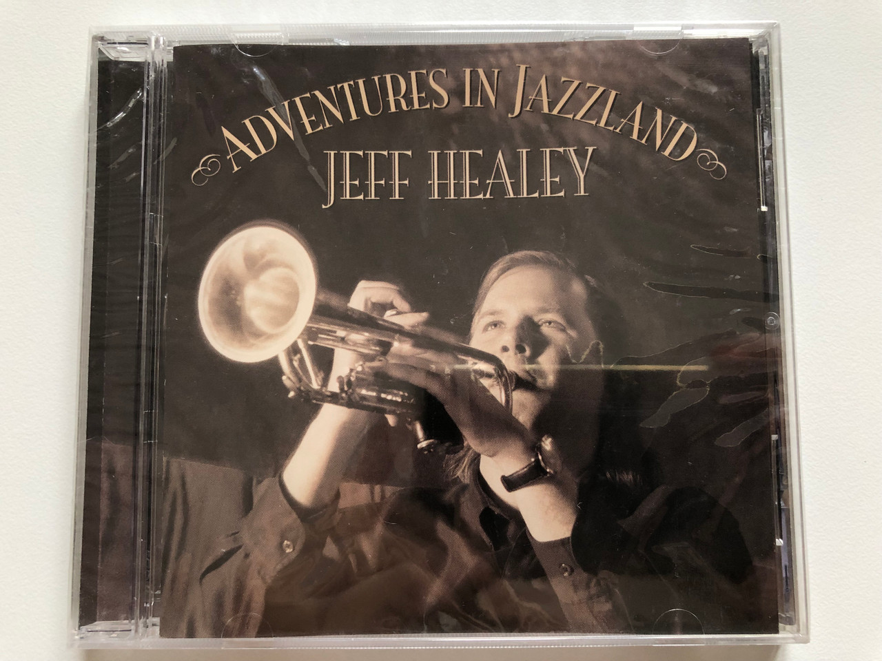 https://cdn10.bigcommerce.com/s-62bdpkt7pb/products/0/images/201211/Adventures_In_Jazzland_-_Jeff_Healey_Stony_Plain_Records_Audio_CD_2006_SPCD_1313_1__37374.1638900711.1280.1280.JPG?c=2&_gl=1*yqt4nk*_ga*MjA2NTIxMjE2MC4xNTkwNTEyNTMy*_ga_WS2VZYPC6G*MTYzODg5MjM0OC4yMDUuMS4xNjM4OTAwNjEzLjM.