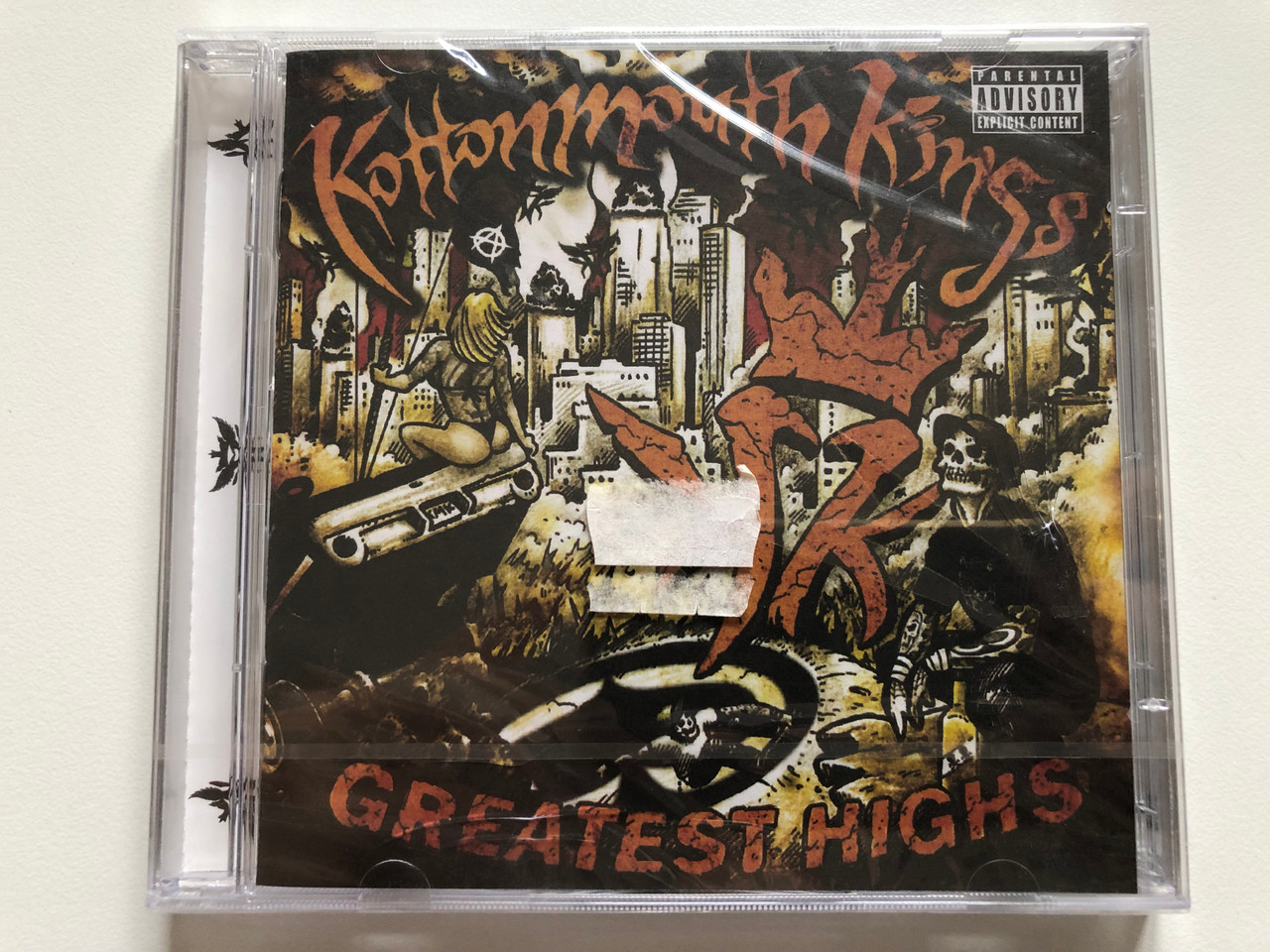 https://cdn10.bigcommerce.com/s-62bdpkt7pb/products/0/images/201305/Kottonmouth_Kings_Greatest_Highs_Suburban_Noize_Records_2x_Audio_CD_2008_509996_17529_27_1__75958.1638984681.1280.1280.JPG?c=2&_gl=1*1w1rba2*_ga*MjA2NTIxMjE2MC4xNTkwNTEyNTMy*_ga_WS2VZYPC6G*MTYzODk3MDI5OS4yMDYuMS4xNjM4OTg0MjQwLjEw
