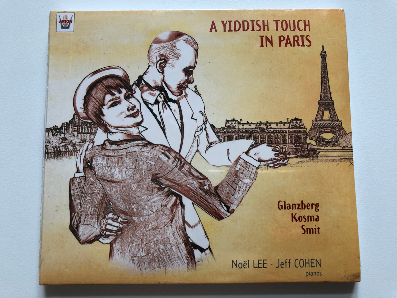 https://cdn10.bigcommerce.com/s-62bdpkt7pb/products/0/images/201312/A_Yiddish_Touch_In_Paris_-_Glazberg_Kosma_Smit_Nol_Lee_Jeff_Cohen_pianos_Arion_Audio_CD_2001_ARN_68454_1__24499.1638985619.1280.1280.JPG?c=2&_gl=1*18d74mt*_ga*MjA2NTIxMjE2MC4xNTkwNTEyNTMy*_ga_WS2VZYPC6G*MTYzODk3MDI5OS4yMDYuMS4xNjM4OTg1NTA3Ljk.