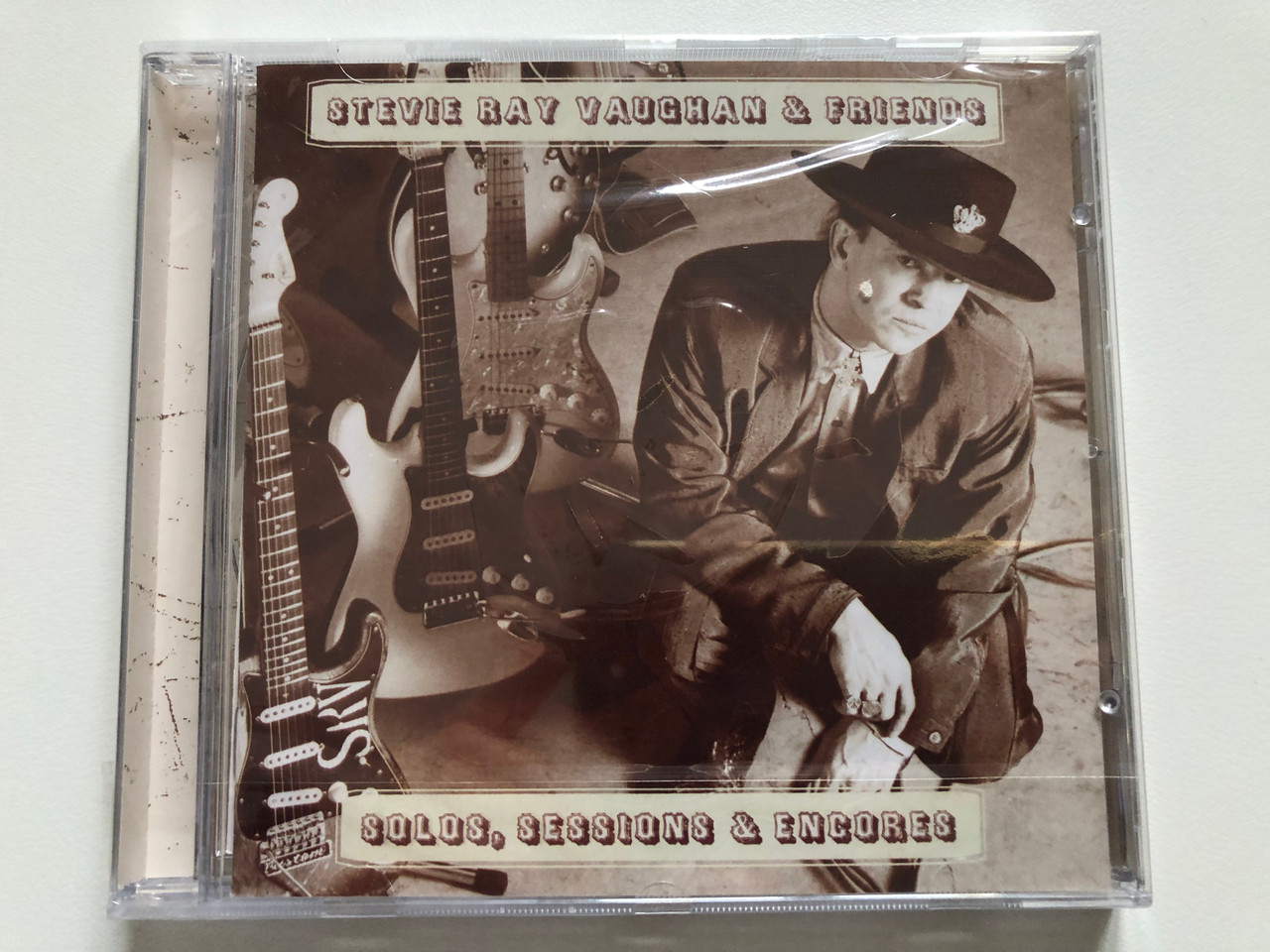 https://cdn10.bigcommerce.com/s-62bdpkt7pb/products/0/images/201677/Stevie_Ray_Vaughan_Friends_Solos_Sessions_Encores_Epic_Audio_CD_2007_82876872312_1__99058.1639408271.1280.1280.JPG?c=2&_gl=1*1ahwabh*_ga*MjA2NTIxMjE2MC4xNTkwNTEyNTMy*_ga_WS2VZYPC6G*MTYzOTQwMjM2NS4yMTQuMS4xNjM5NDA4MTQ0Ljg.