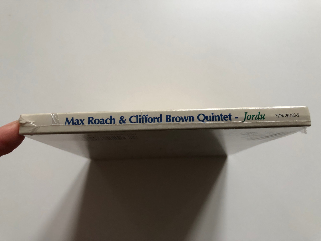 https://cdn10.bigcommerce.com/s-62bdpkt7pb/products/0/images/201806/Max_Roach_Clifford_Brown_Quintet_Jordu_Dreyfus_Jazz_Audio_CD_2005_FDM_36780-2_3__75055.1639562163.1280.1280.JPG?c=2&_gl=1*1k4ehw7*_ga*MjA2NTIxMjE2MC4xNTkwNTEyNTMy*_ga_WS2VZYPC6G*MTYzOTU1MjAyMC4yMTcuMS4xNjM5NTYyMDY1LjQy