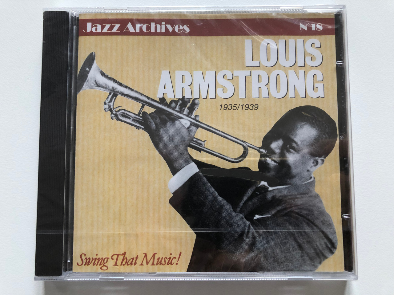https://cdn10.bigcommerce.com/s-62bdpkt7pb/products/0/images/201813/Louis_Armstrong_1935-1939_Swing_That_Music_Jazz_Archives_N_18_EPM_Audio_CD_1990_157312_1__66414.1639562830.1280.1280.JPG?c=2&_gl=1*1m235u8*_ga*MjA2NTIxMjE2MC4xNTkwNTEyNTMy*_ga_WS2VZYPC6G*MTYzOTU1MjAyMC4yMTcuMS4xNjM5NTYyNjk2LjE2