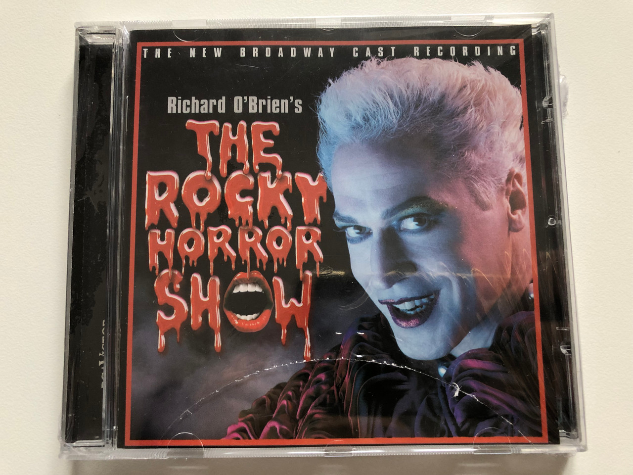 https://cdn10.bigcommerce.com/s-62bdpkt7pb/products/0/images/201870/Richard_OBriens_The_Rocky_Horror_Show_-_The_New_Broadway_Cast_Recording_BMG_Audio_CD_2001_09026_63801_2_1__86889.1639651342.1280.1280.JPG?c=2&_gl=1*8eav3m*_ga*MjA2NTIxMjE2MC4xNTkwNTEyNTMy*_ga_WS2VZYPC6G*MTYzOTY0NjQ1OC4yMTkuMS4xNjM5NjUxMzQ1LjYw